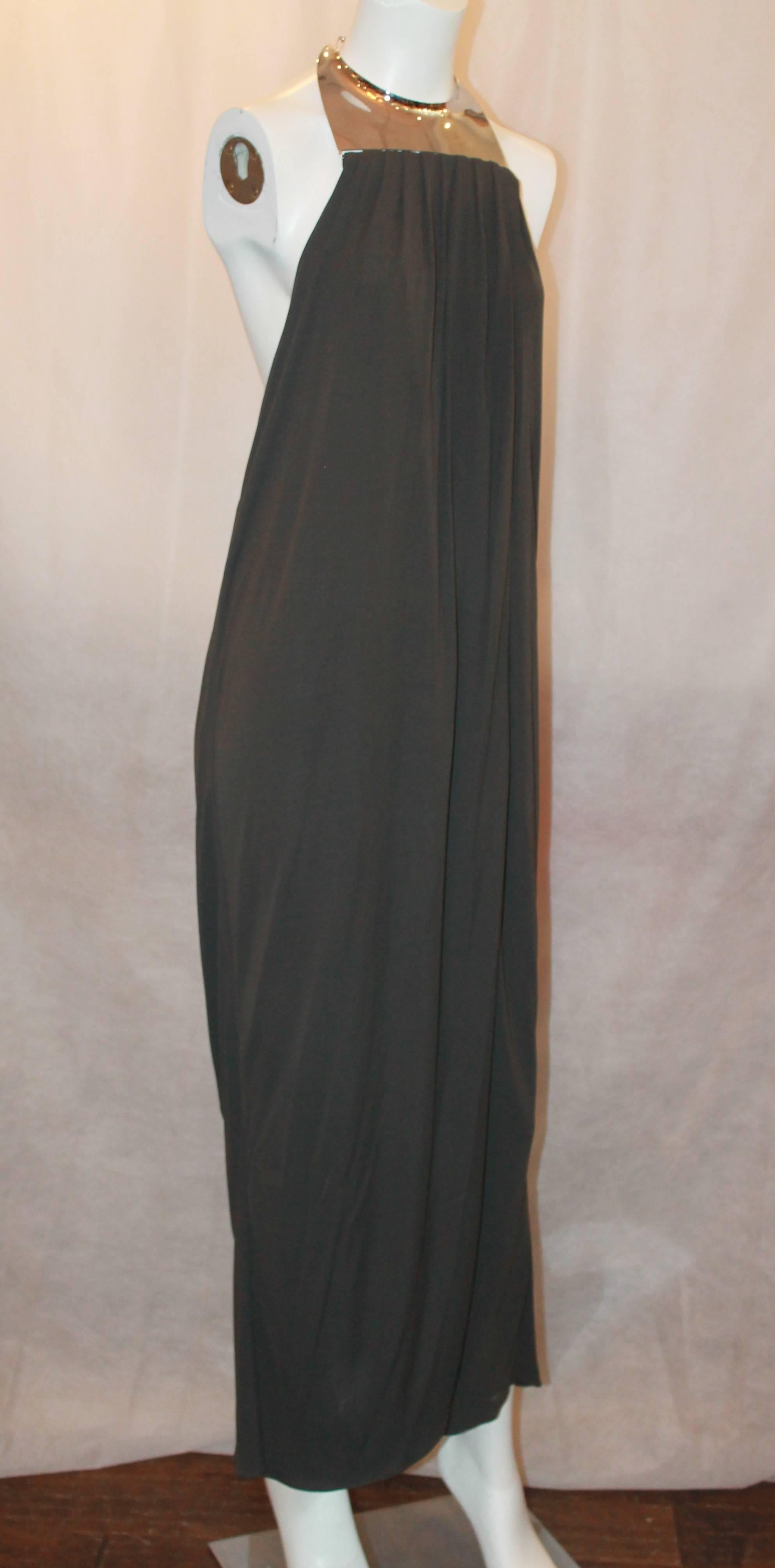 Michael Kors Grey jersey gown w/ silver hardware neck/collar-Sz 8-NWT 
Retail $3,900 This beautiful jersey gown crosses in the front and has a very low and sexy back. It is super chic and a true statement piece to wear to any black tie event.