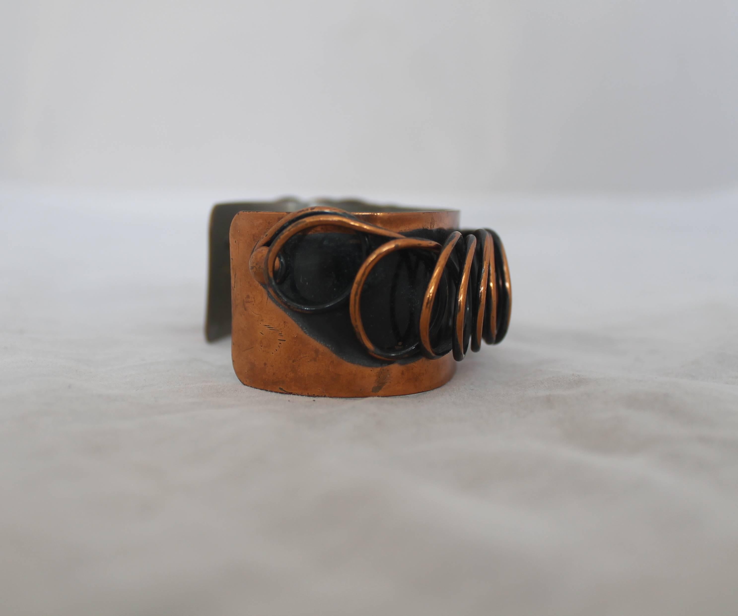 Renoir Vintage Handmade Copper Coil Cuff Bracelet - 1950's.  This unique vintage bracelet is in very good vintage condition with only minor wear consistent with its age.  It features a black band painted behind the coil to add depth to the coil