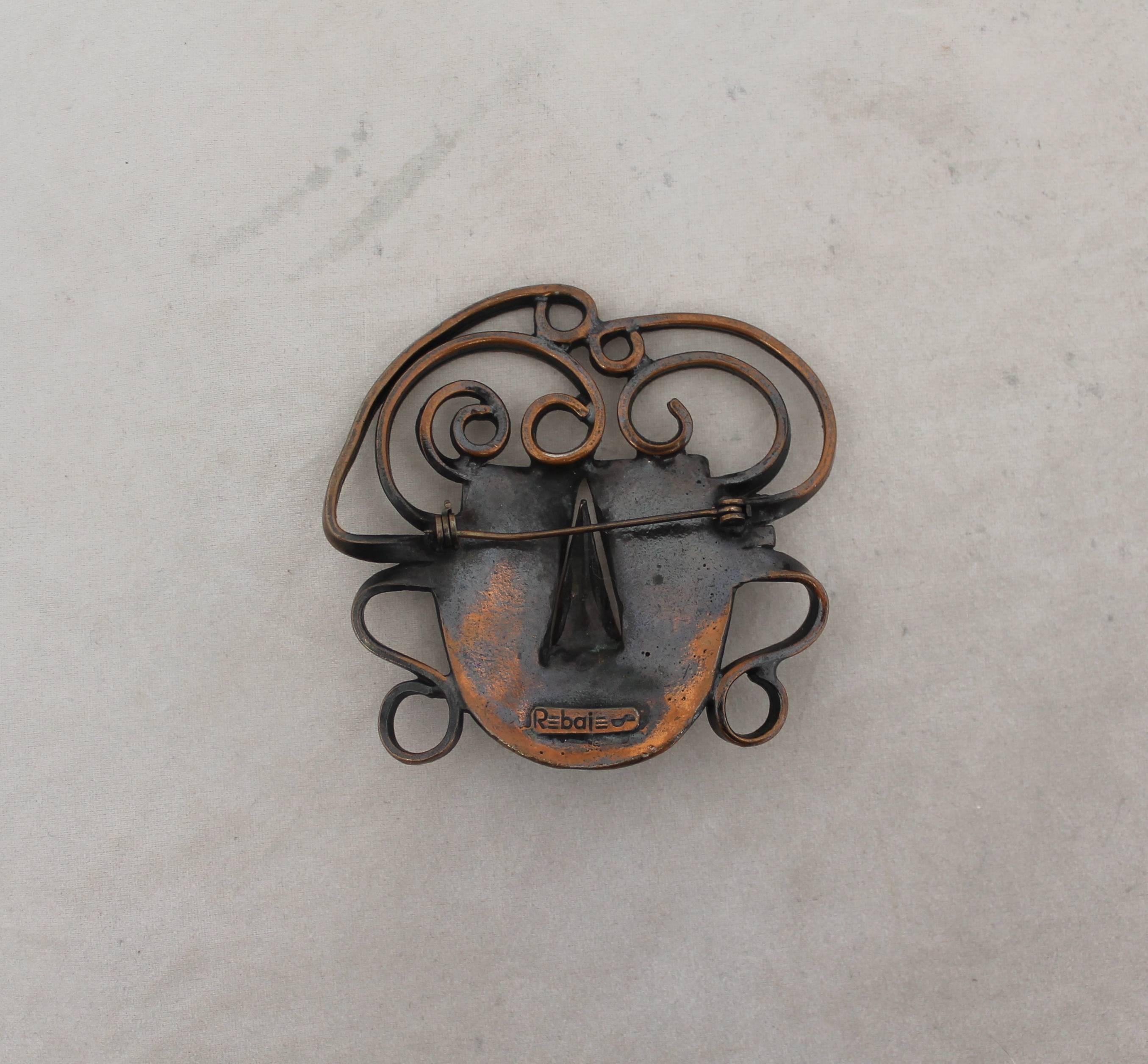 Rebajes Vintage Copper Brazilian Mask Pin - 1950's.  This unique vintage pin is in fair vintage condition with wear consistent with its age, mainly tarnishing in the front.  It features a 