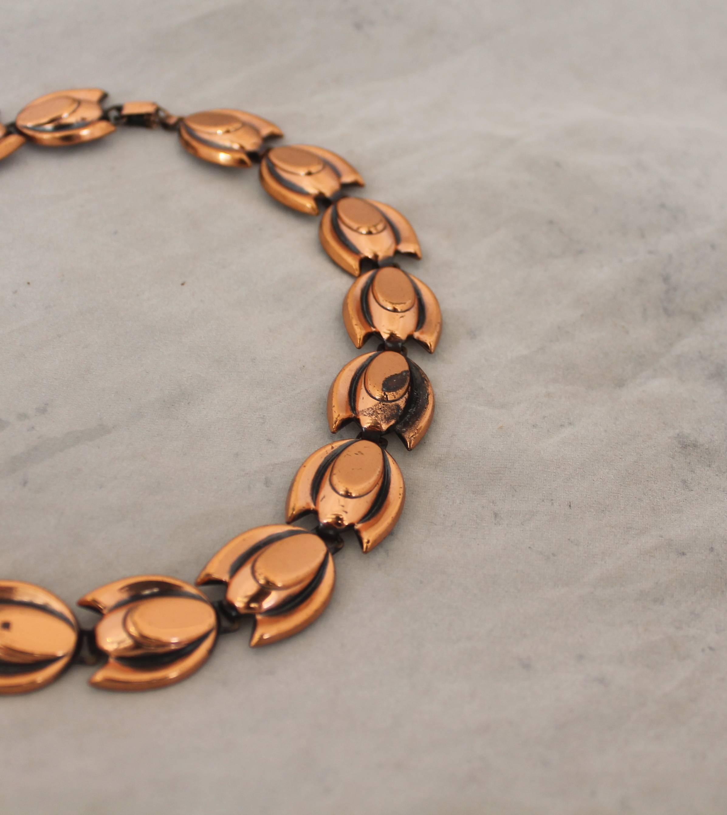 Matisse-Renoir Vintage Copper Tulip Shaped Necklace - circa 1950's. This piece is in excellent vintage condition with very minor wear or staining, except in one area shown in the photos. They have an anodized look in the back and a small clasp with