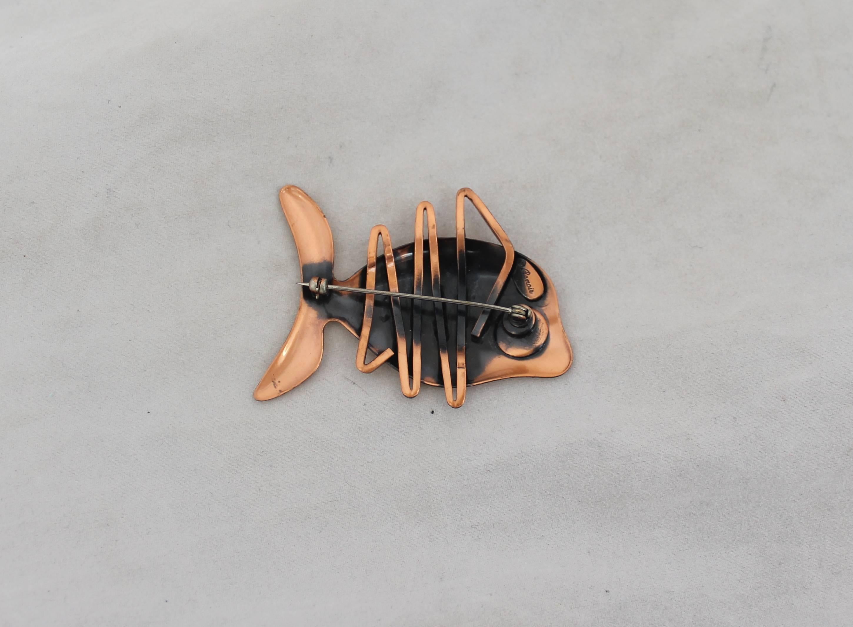 Renoir Vintage Copper Coral Fish Pin - 1950's.  This adorable vintage pin is in excellent vintage condition.  It features a coral fish shape, the Renoir signature, and it is composed of a shiny copper.

Measurements:
Length (at longest point):