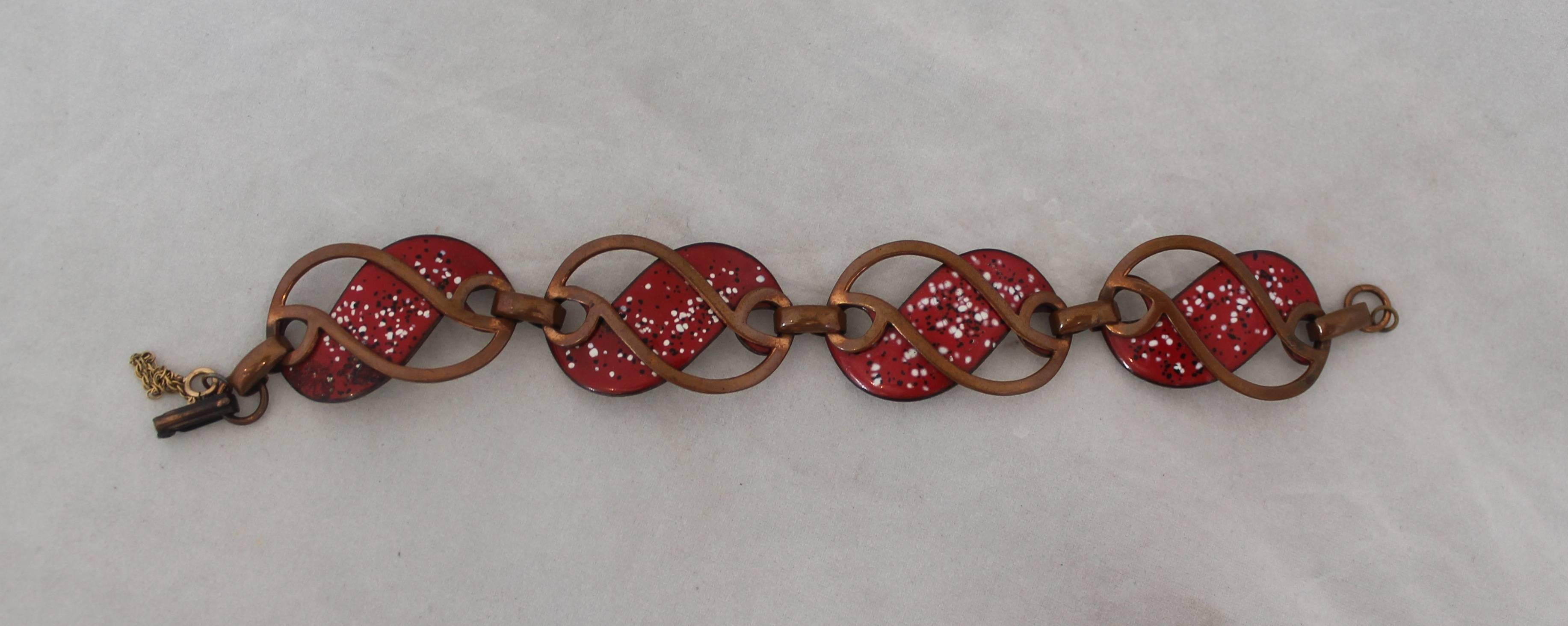Rebajes Vintage Copper Cut-out Bracelet with Red Enamel - circa 1950's. This bracelet is in very good vintage condition with some tarnishing due to its age. The red enamel sections are spotted with white and black paint. 

Length- 8.25