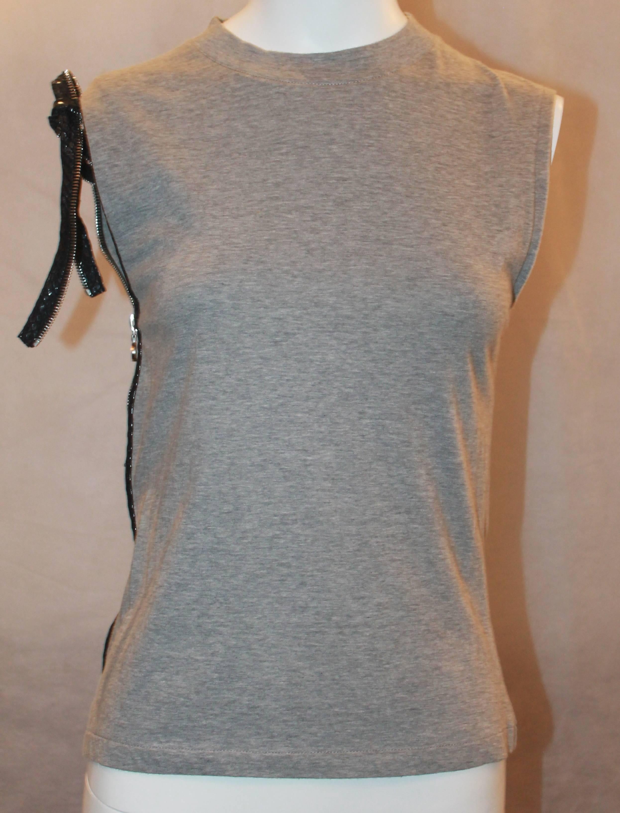 Christian Dior Grey Cotton Sleeveless Top w/ Leather Side Zip & Bow- US: 8 FR:40.  This top is in excellent condition.  It features a unique leather side zip that is functional and continues up into a bow on the right shoulder.  It is a great