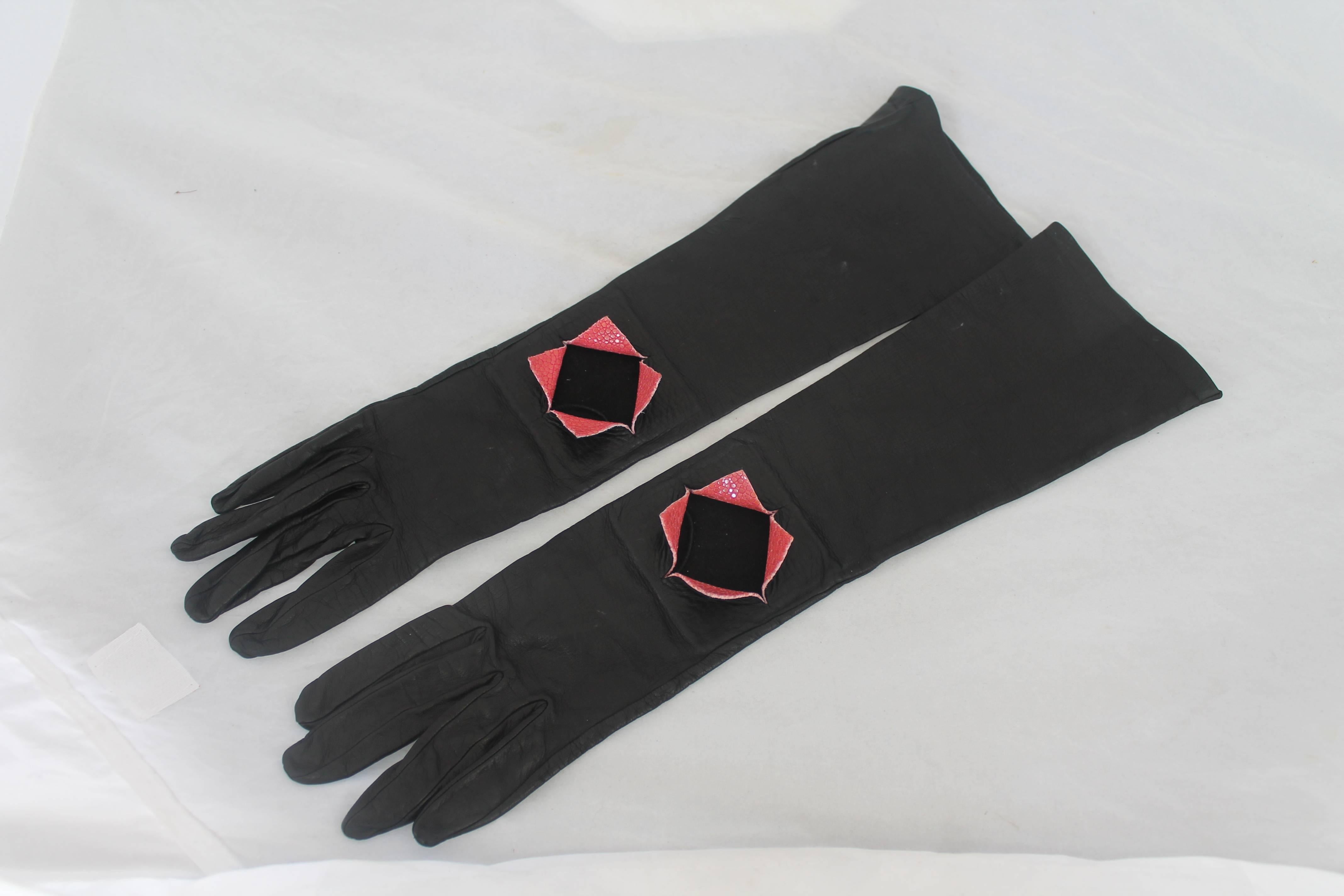 Chanel Black Kidskin Gloves with Pink Stingray Cutout - sz 7. These gloves are in very good condition with the only issue being slight marks (image 7) and another slight section of the same marks on the under the right glove. The stingray cutout is
