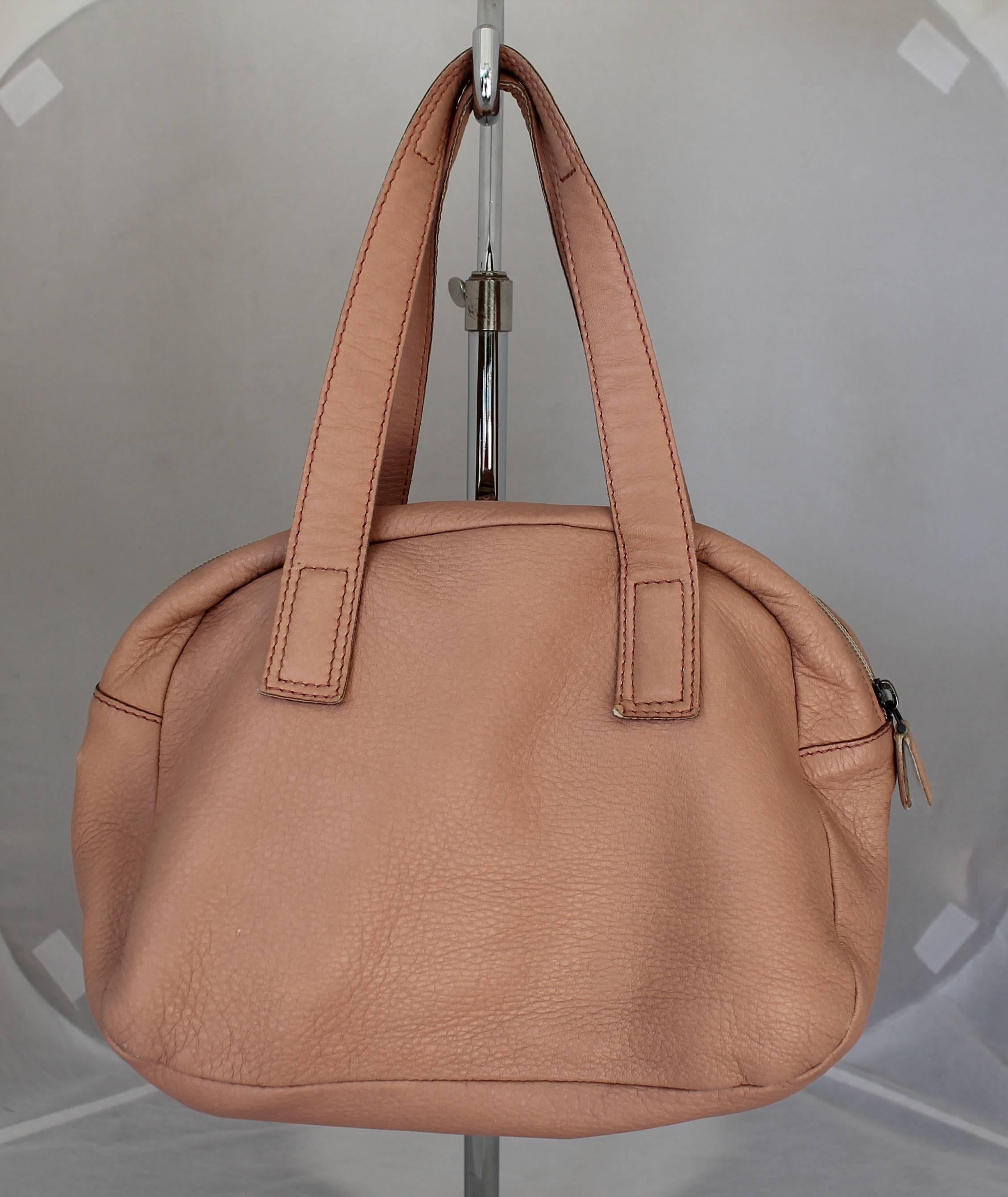Bottega Veneta Dustry Rose Lambskin Small Shoulder Bag w/ Suede Lining.  This lovely bag is in good condition with some wear consistent with its age and a zipper that is worn.  It features a pretty dusty rose leather and suede lining.  This is a