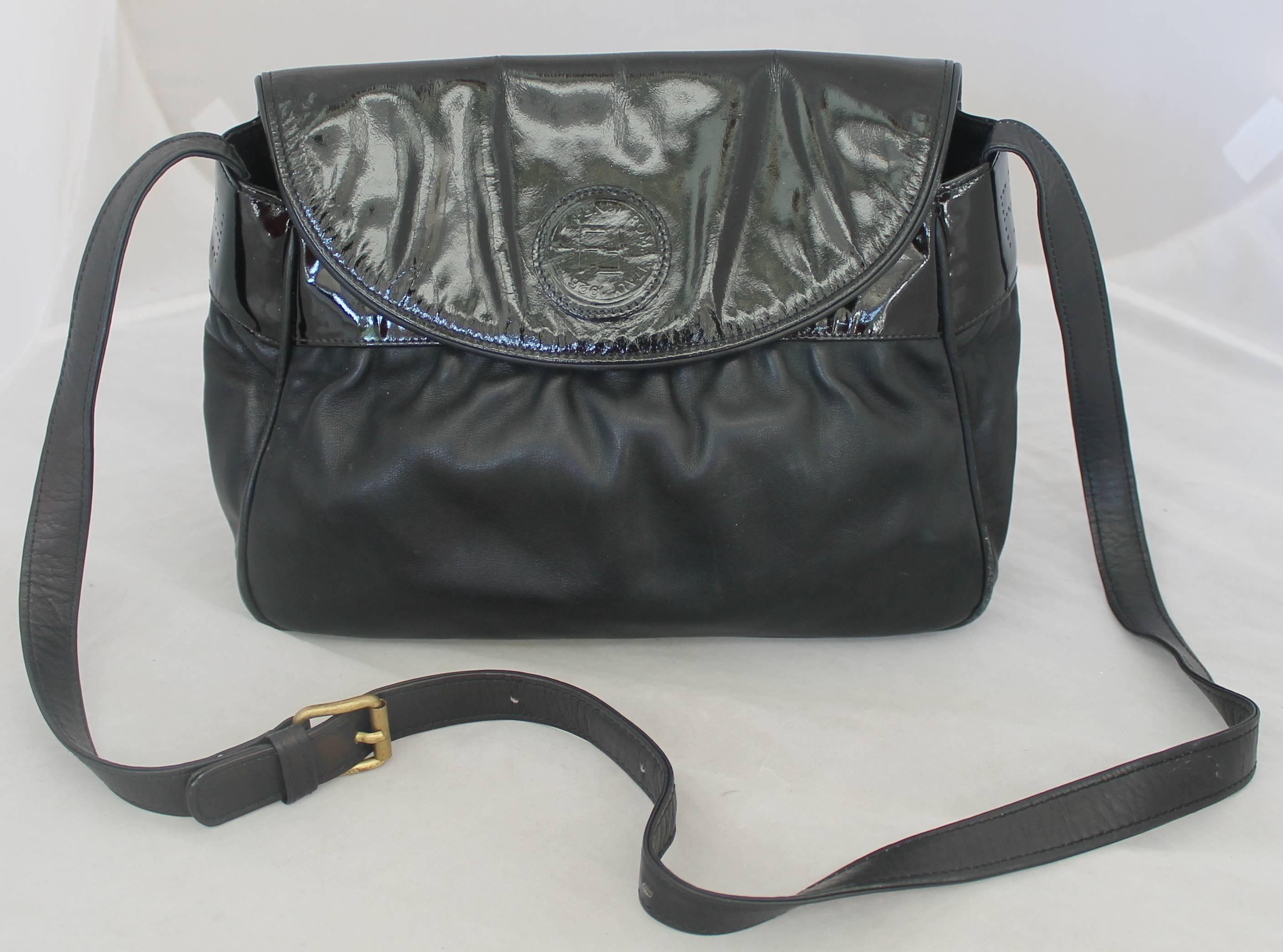Fendi Vintage Black Leather & Patent Crossbody - Circa 1990's.  This lovely Fendi bag is in good vintage condition with only some wear consistent with its age.  It features black leather and black patent, the Fendi logo on the patent flap, a button