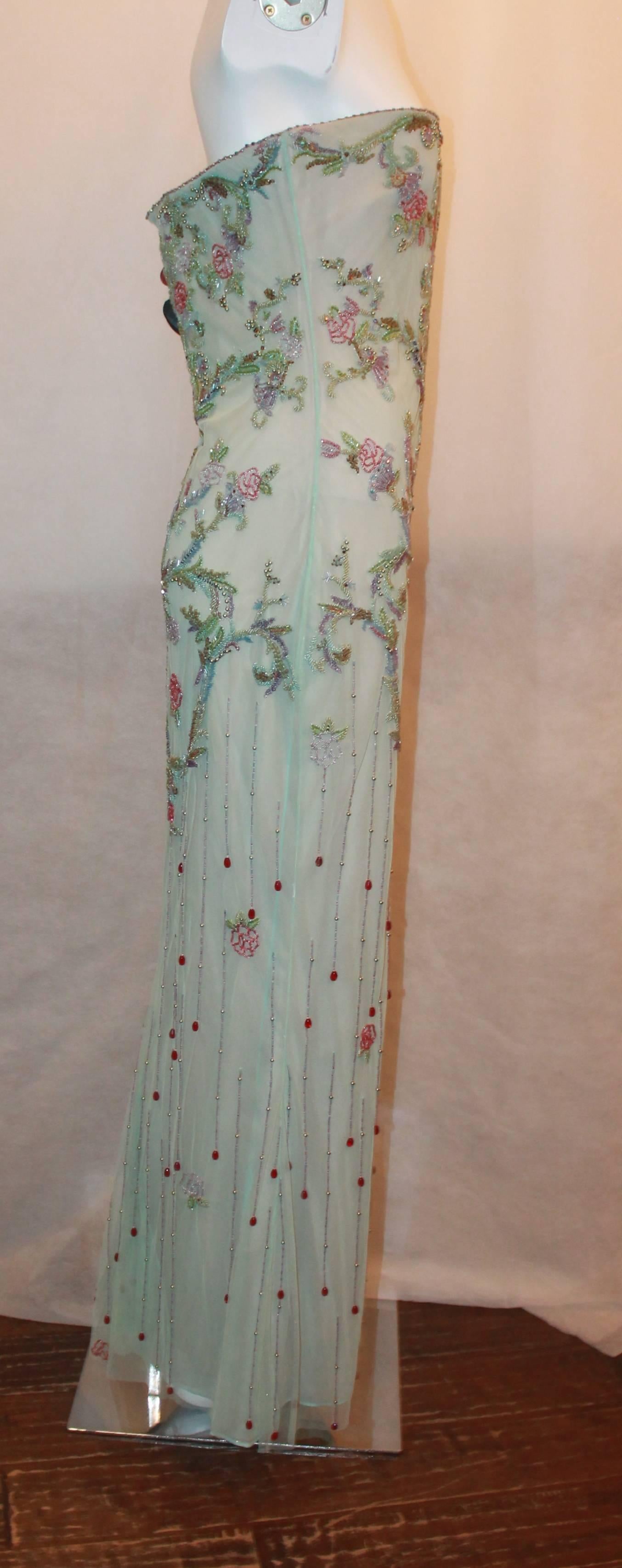 Reem Acra Art Deco Aqua and Multi Floral Silk Blend Beaded Gown - 10.  This gorgeous gown is in very good condition with only some minor sections with beading coming off.  It features beautiful floral beading with beading also along the trim on the