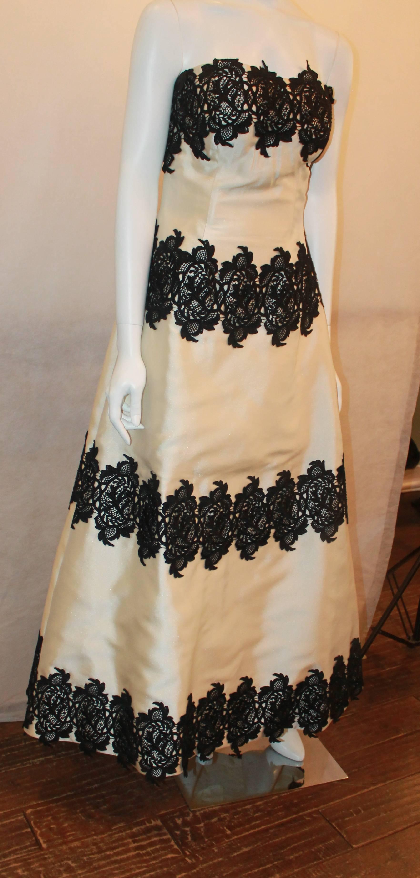 Helen Morley Ivory Silk Blend w/ Black Lace Strapless Gown w/ Shawl - 12.  This gorgeous gown is in excellent condition.  It features a gorgeous ivory silk blend material, an intricate black lace, a built in corset and bustier, and a back zipper. 