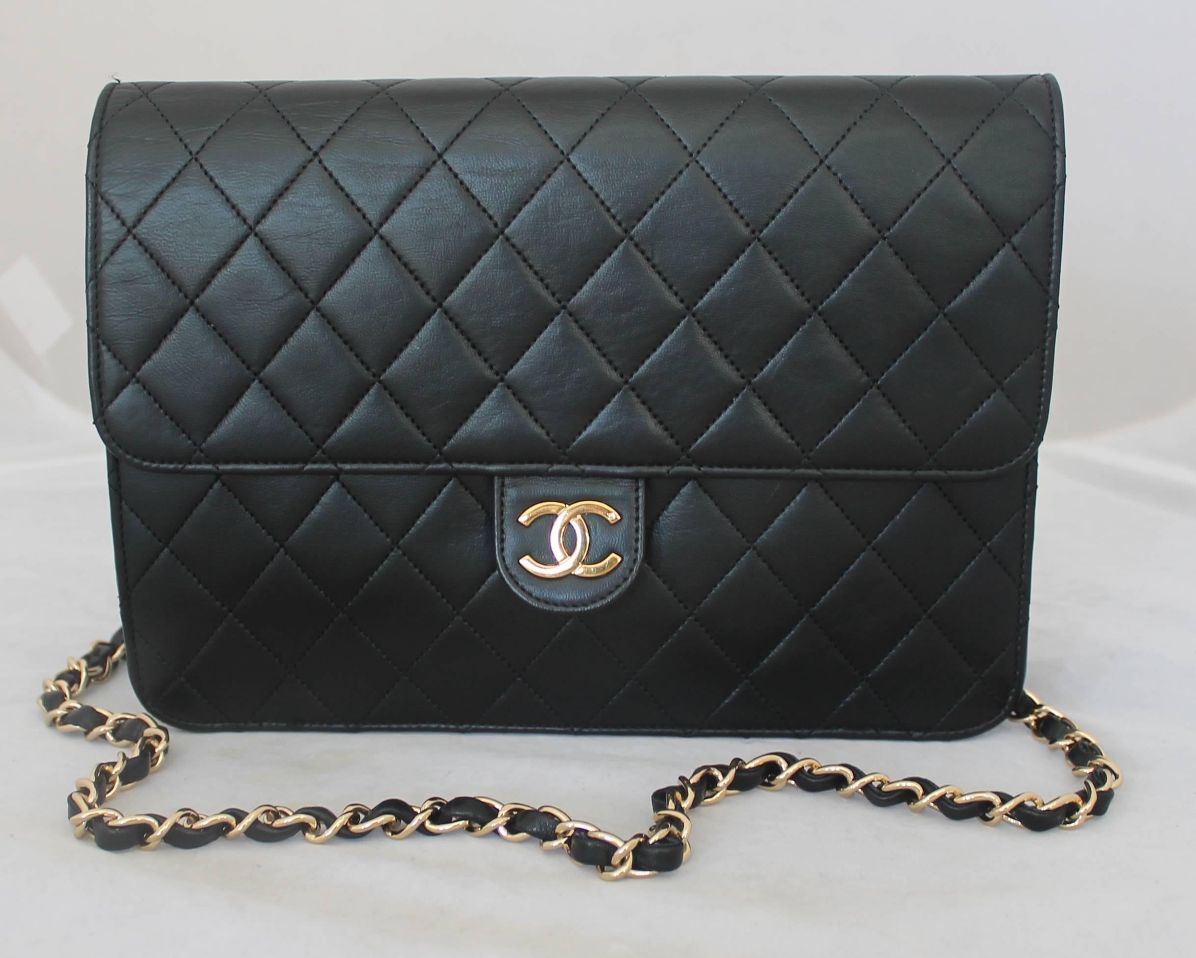 Chanel Black Quilted Lambskin Classic Single Flap Handbag - GHW - Circa Early 1980's.  This beautiful classic Chanel is in very good vintage condition with only some wear in the inside pocket.  It features the signature black quilted lambskin, a
