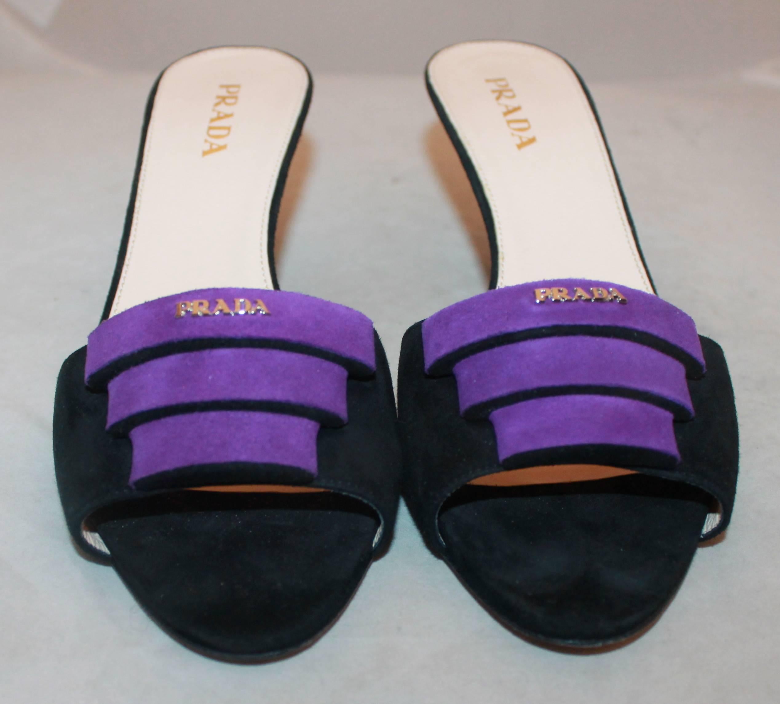 Prada Black Suede Slide w/ Front Purple 3D Design - 38.5.  These unique slides are in excellent condition, you can barely even tell that they have been worn.  They feature a black suede material with a purple suede 3D design on the toe,   a silver