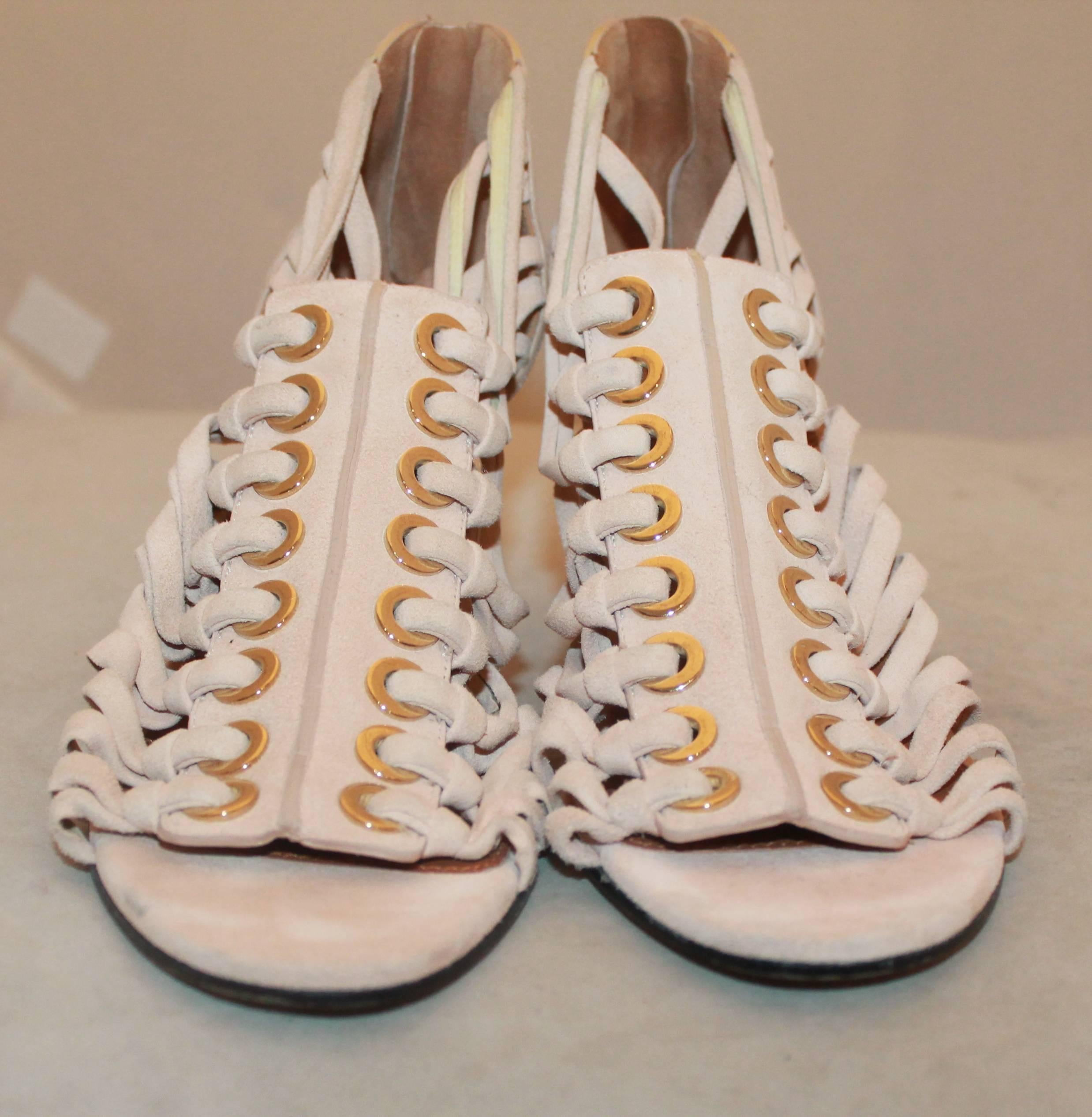 Givenchy Pale Pink Suede Strappy Heels - 8.  These sexy heels are in excellent condition with minimal wear to the sole from very minor use.  They feature a gorgeous, girl pale pink suede material, numerous straps, and a back zipper.  These heels are