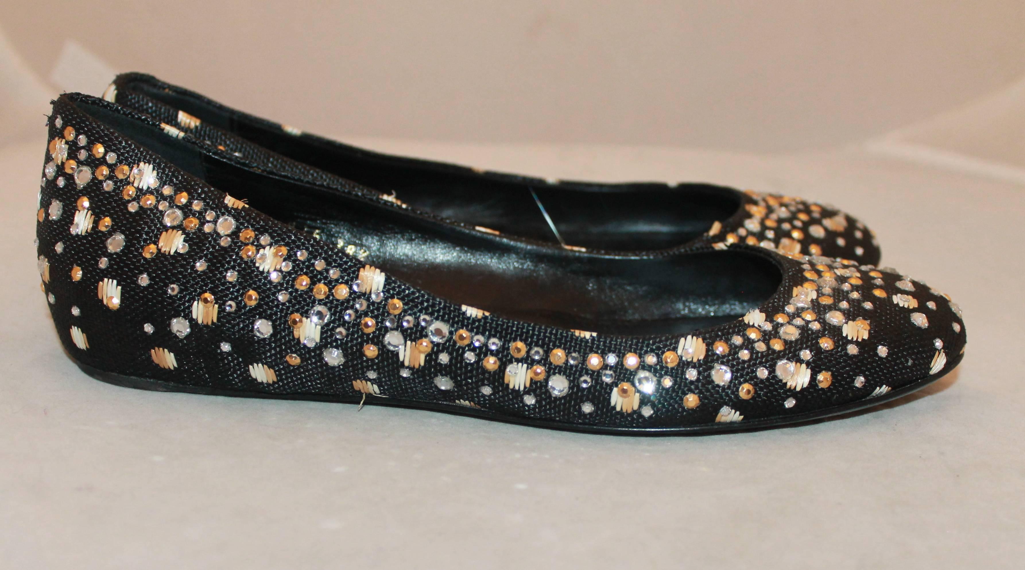 Valentino Black Raffia Ballerina Style Flats w/ Rhinestones - 38.5.  These shoes are in very good condition with some wear to the sole consistent with their use.  They feature a lovely black raffia material, a ballerina style look, and some