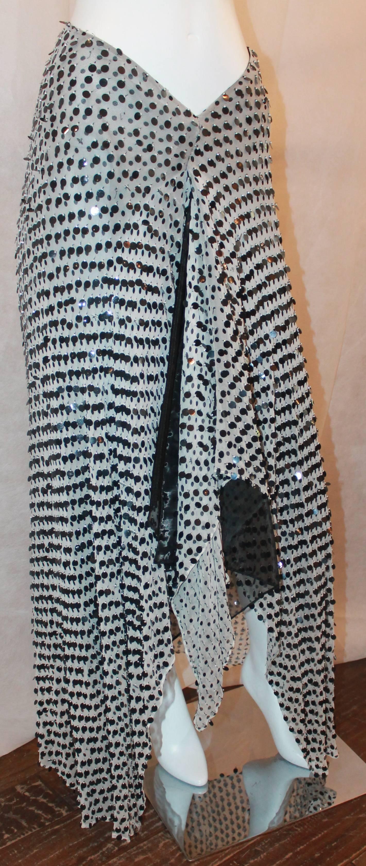 Giorgio Armani 1990's Black and White Chiffon High-Low Asymmetrical Palette Skirt - 42.  This beautiful skirt is in good condition with only very few not noticeable missing sequins.  It features a unique asymmetrical hem, an opening up to the waist,