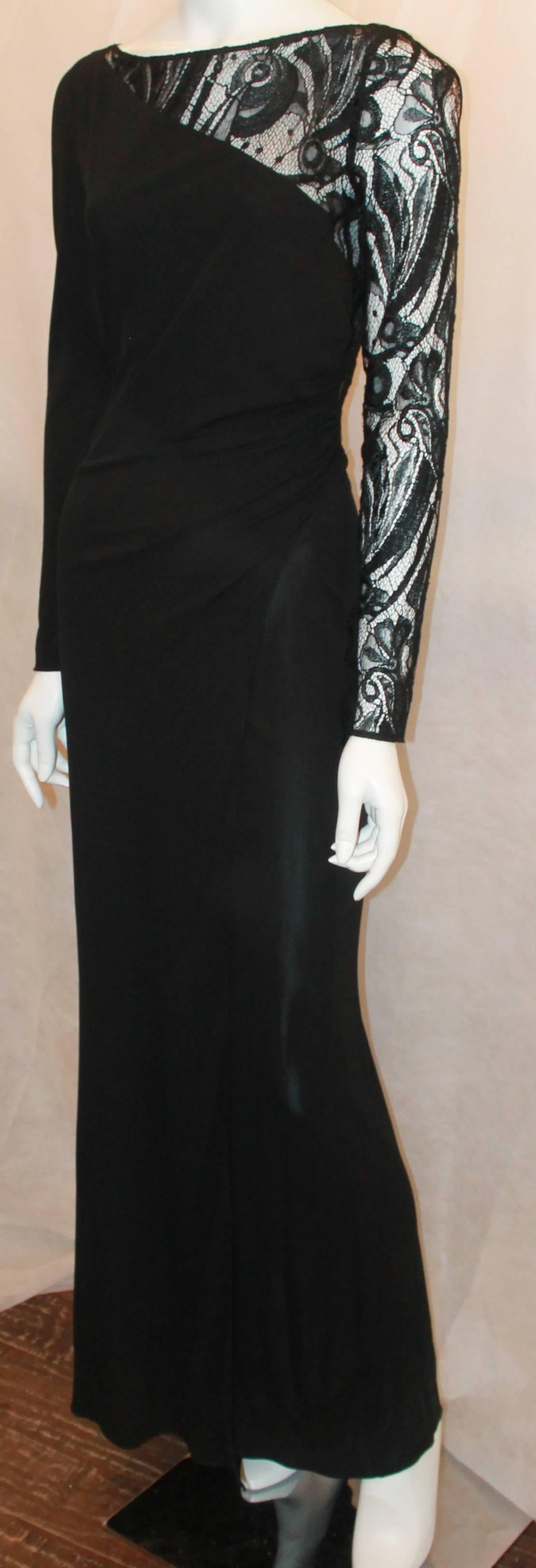 Emilio Pucci Black Silk Jersey and Lace Long Sleeve Wrap Gown - 8.  This gown is in excellent condition.  It features a black jersey material, an elegant black lace see through back and left arm, side ruching, and an invisible zipper on the right