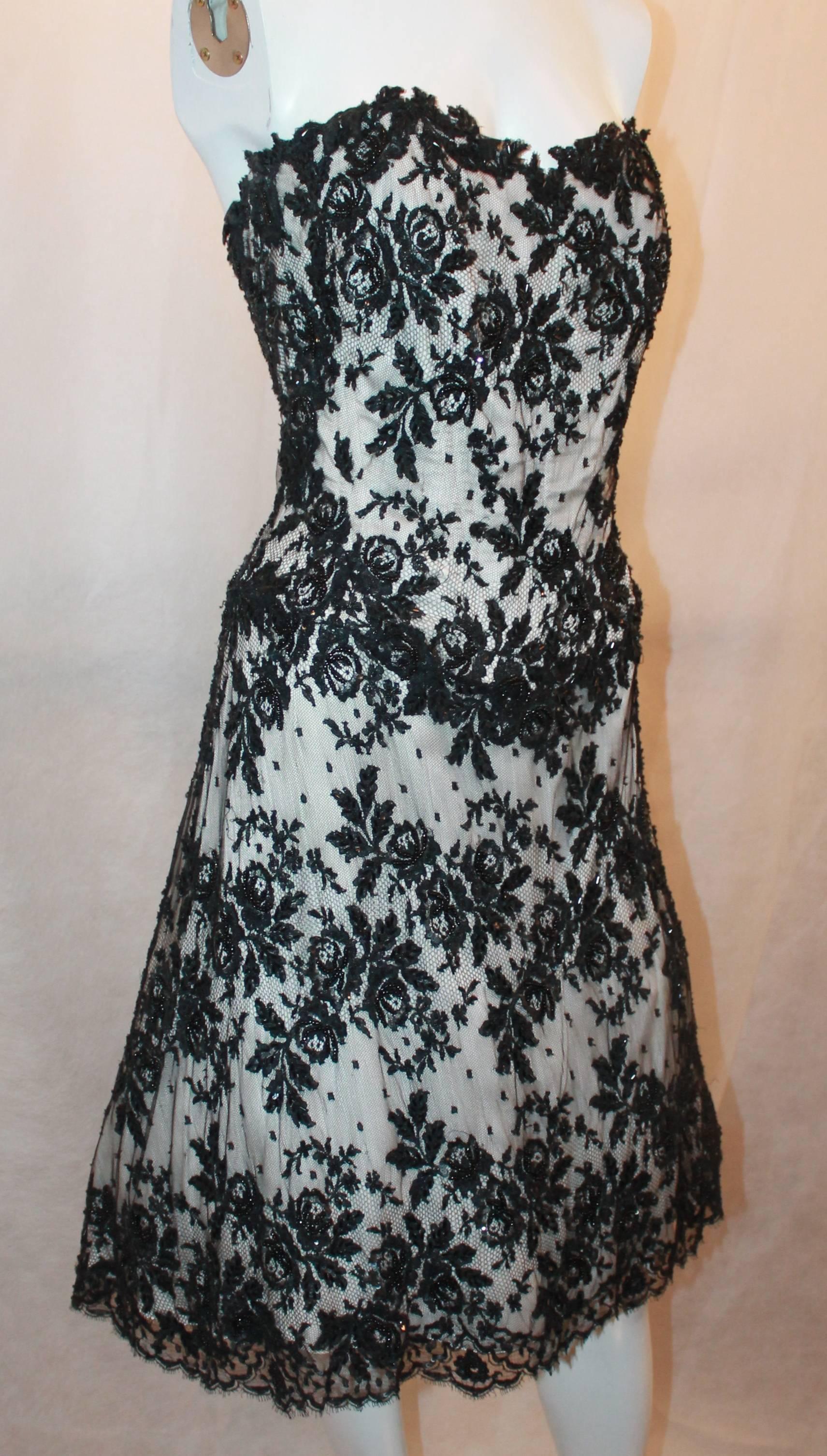 Vicky Tiel Black & White Lace Strapless Dress w/ Beading - 44.  This beautiful dress is in excellent condition.  It features a gorgeous black lace over a white nylon blend, a built-in corset to the hips, beading detail, a chiffon lining, and a