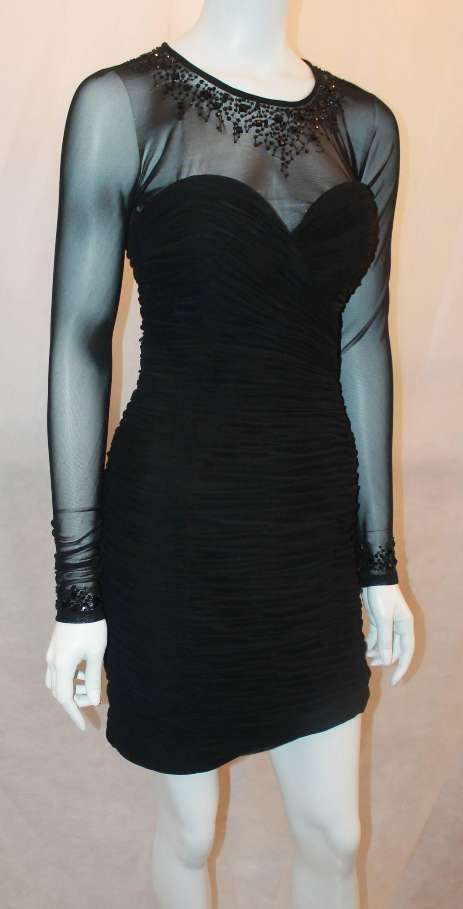 Vicky Tiel Black Jersey Cocktail Dress w/ Beading Around the Neck & Wrists - 6.  This gorgeous dress is in excellent condition.  It features a lovely black silk jersey, beading around the neck and wrists, sheer mesh, a back top button, and it is