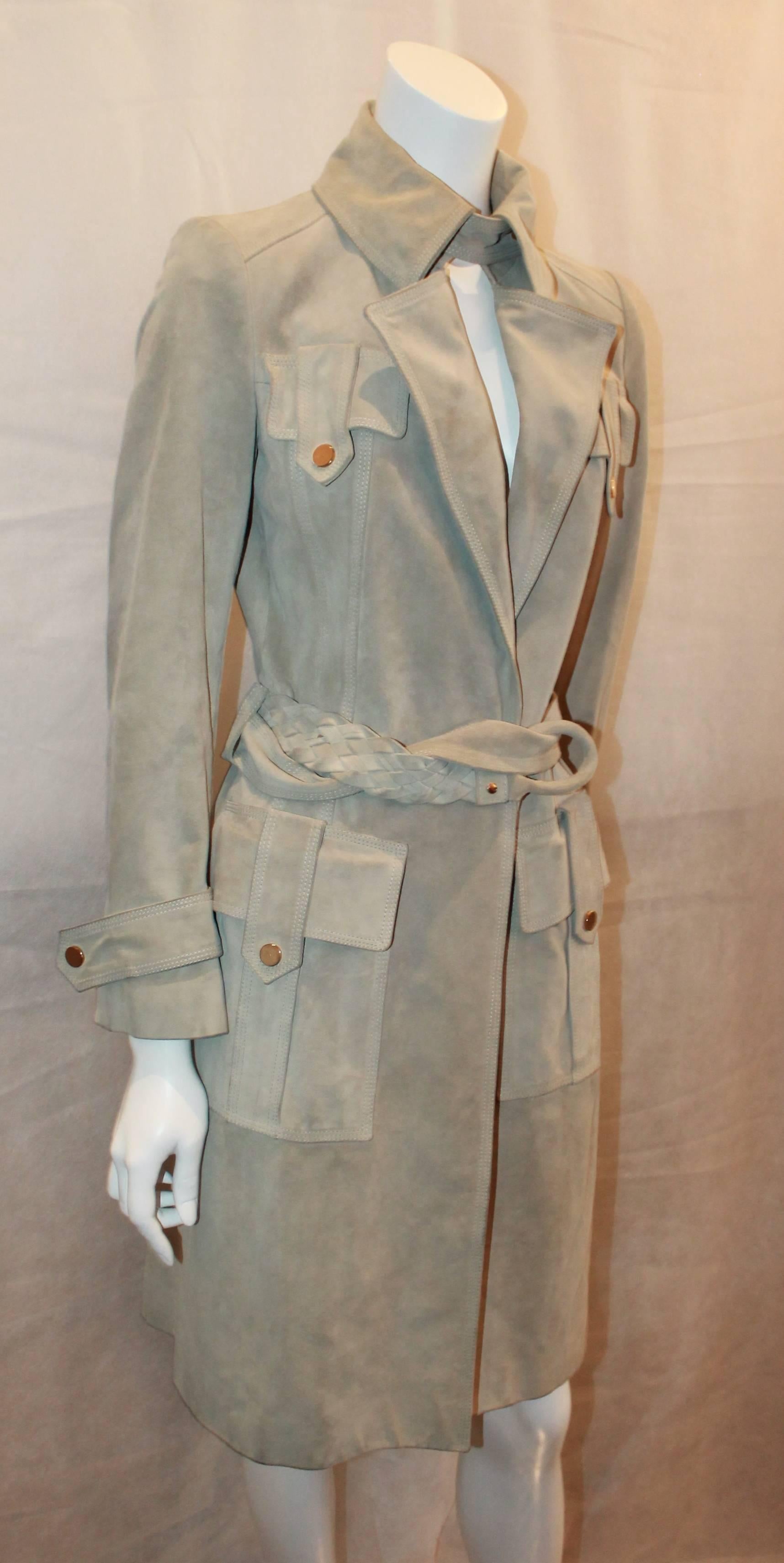 Gucci Beige Suede Trench Coat with Braided Belt - S. This coat is in good condition with light wear all over. It  has a collared neckline with double pockets on the top and bottom. The coat itself is heavy, but the color is light and