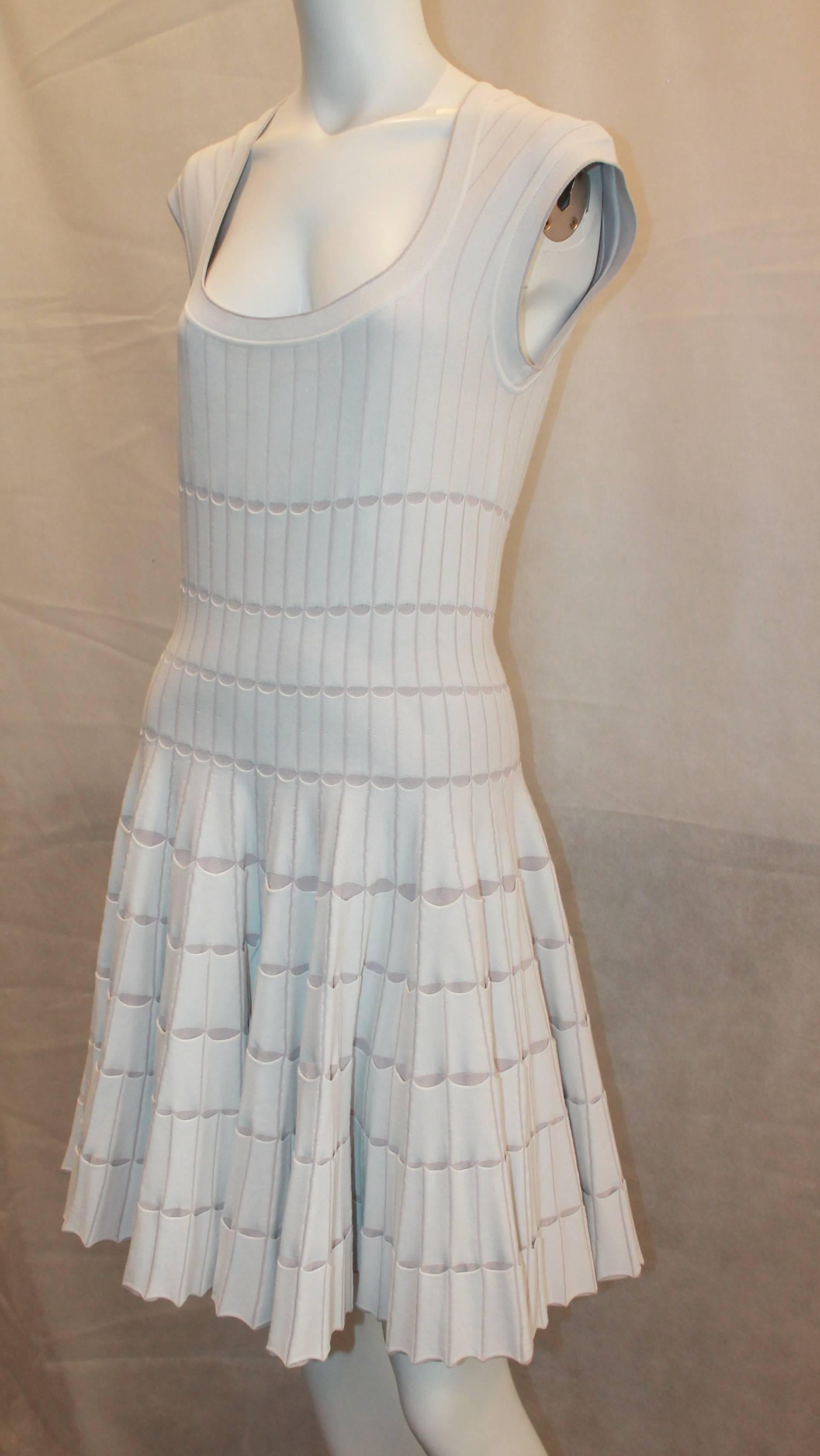 Azzedine Alaia White & Taupe Stretch Pleated Dress - 8. This dress is in very good condition with minor general wear all over. It is a sleeveless ribbed dress with the skirt having an according style pleating and small slits all over where the taupe
