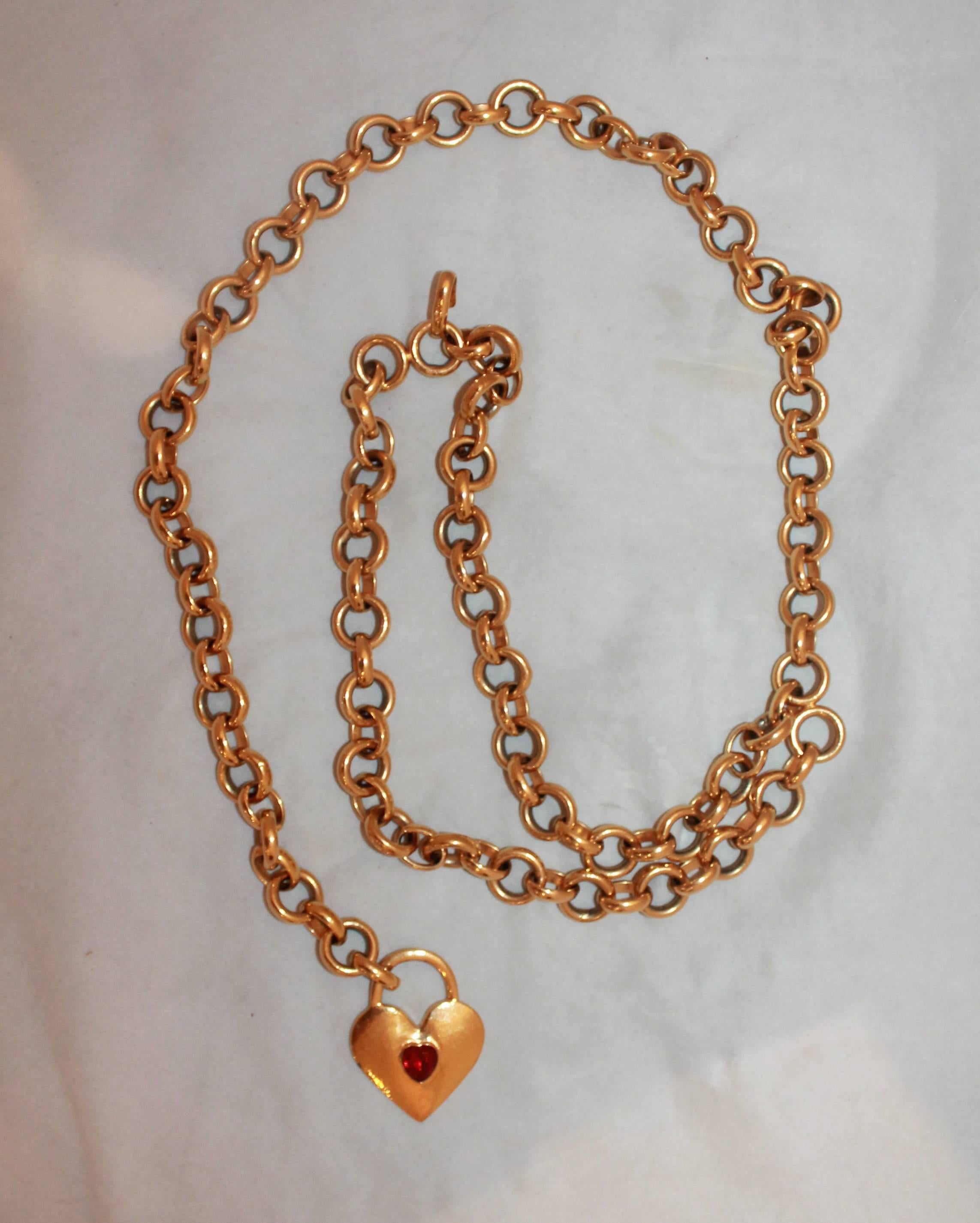 Chanel 1970's Vintage Goldtone Chain Link Belt & Necklace with Heart & Red Rhinestone. This belt is in excellent vintage condition with minor wear consistent with age, mainly an area of the back of the heart has some paint on the edges coming off as