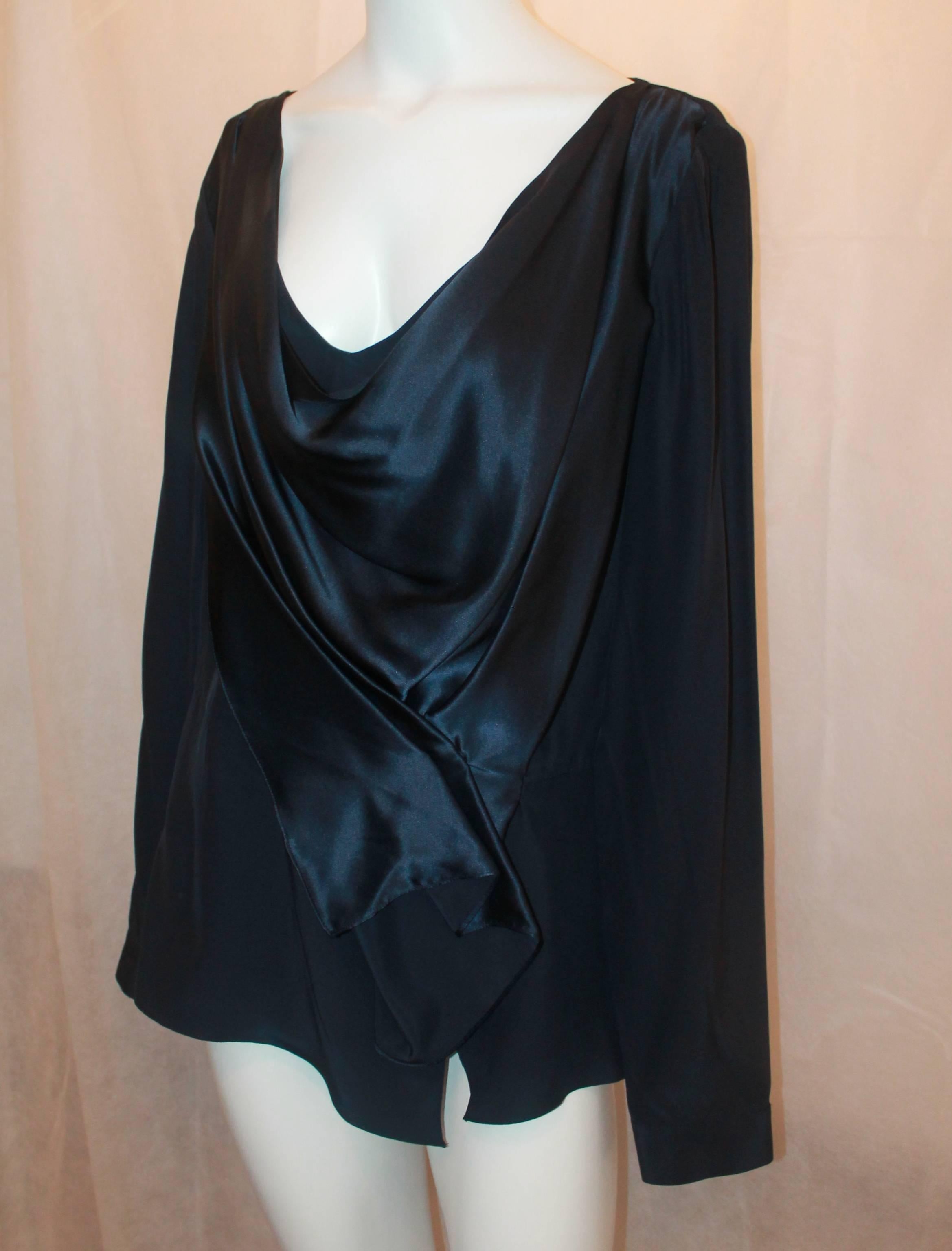 Oscar de la Renta Navy Silk Long Sleeve Blouse - 16. This piece is in excellent condition and is a staple piece. It has one slight pull on the back towards the top. It features a cowl neckline with a flowing front gathering.

Measurements:
Bust-