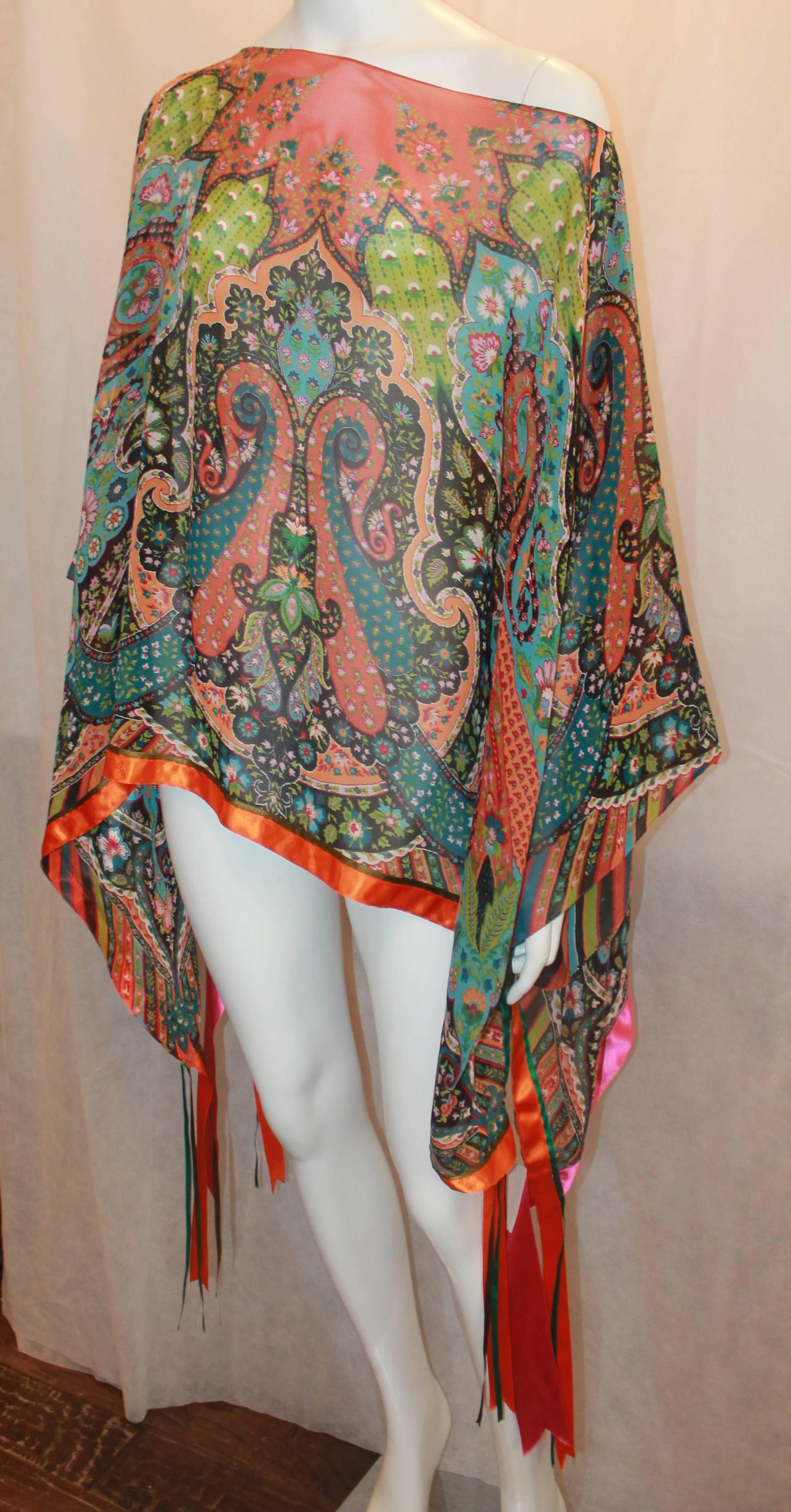 Etro Multi-Colored Paisley Print Silk Chiffon Poncho w/ Ribbon Trim & Hanging Ribbon - OS.  This unique blouse is in excellent condition.  It features a multi colored silk chiffon paisley print fabric, a wide neck slit, an orange, green, and pink