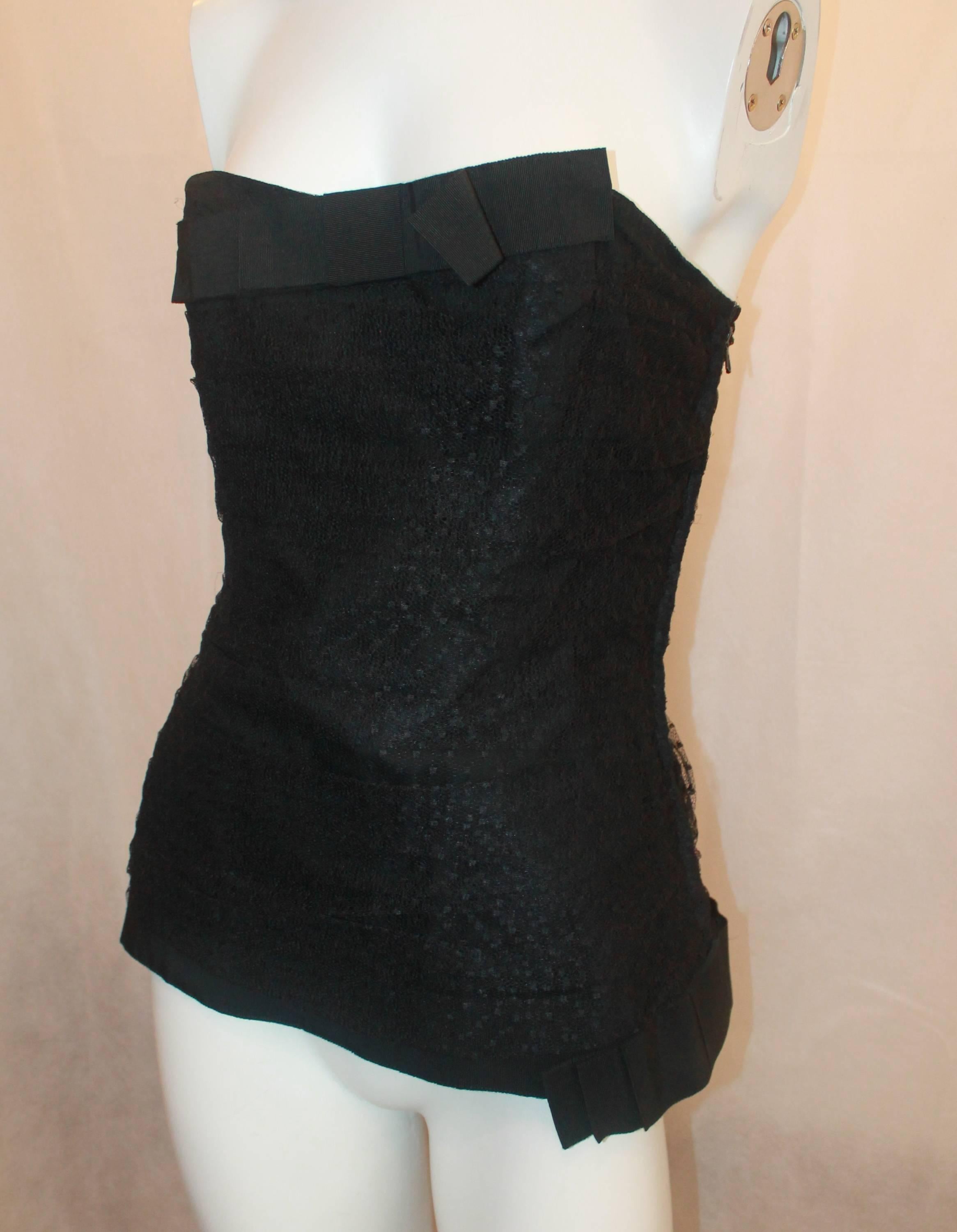 YSL Black Lace & Cotton Strapless Bustier Top w/ Grograin Trim - 44 - 60's-70's.  This sexy vintage top is in excellent vintage condition.  It features a bustier style, a beautiful black lace, a grograin ribbon trip, a bow on the top in the middle