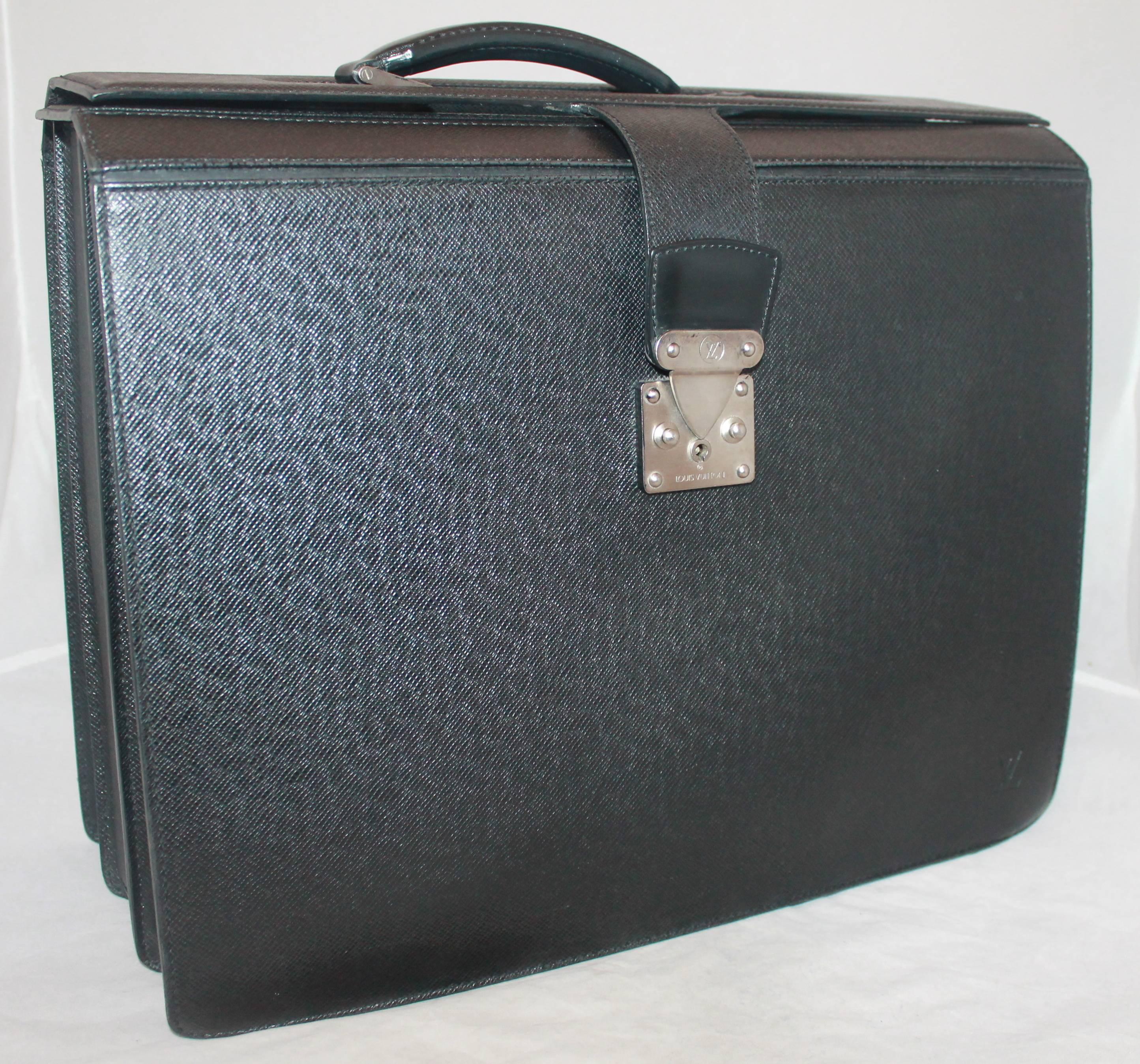 Louis Vuitton Black Large Briefcase w/ 3 Compartments.  This large briefcase is in excellent condition, it was either used once or not at all.  It features a professional black exterior, three very large internal compartments, a back slit for