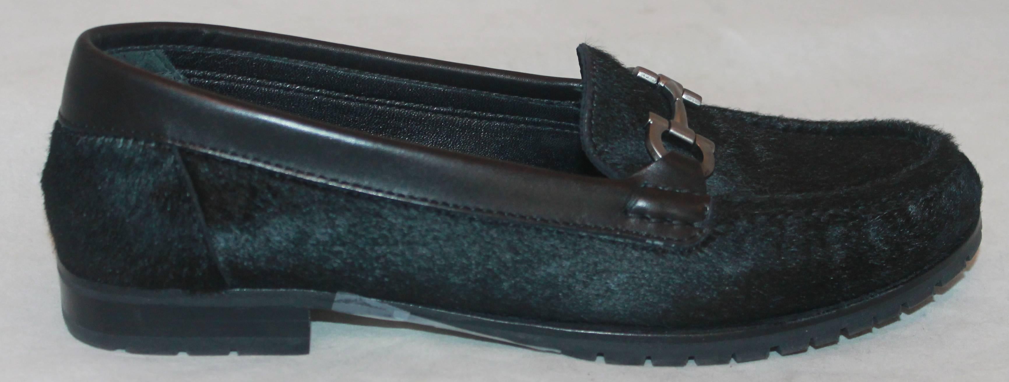 Salvatore Ferragamo Black Pony Hair Loafers w/ Silver Front Buckle - 7AA.  These shoes have minor wear at the bottom of the soul and a small piece of the rubber underneath that is missing.  Other than that they are in very good condition. They