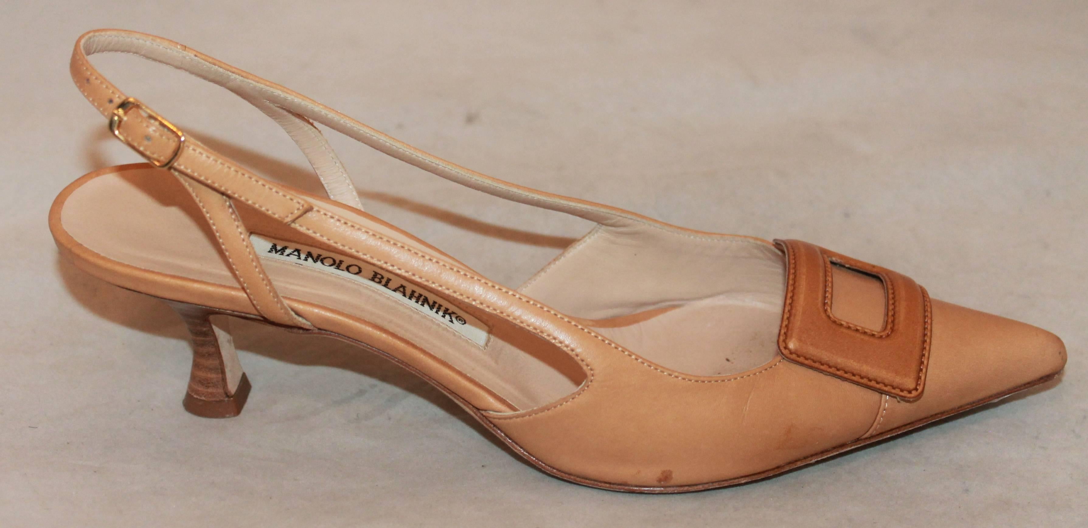 Manolo Blahnik Luggage Leather Kitten Heel Pointed Toe Slingbacks - 7B.  These shoes are in good condition with only a small spot on the right shoe.  They feature a lovely luggage leather, kitten heels, pointed toes, straps with buckles on the