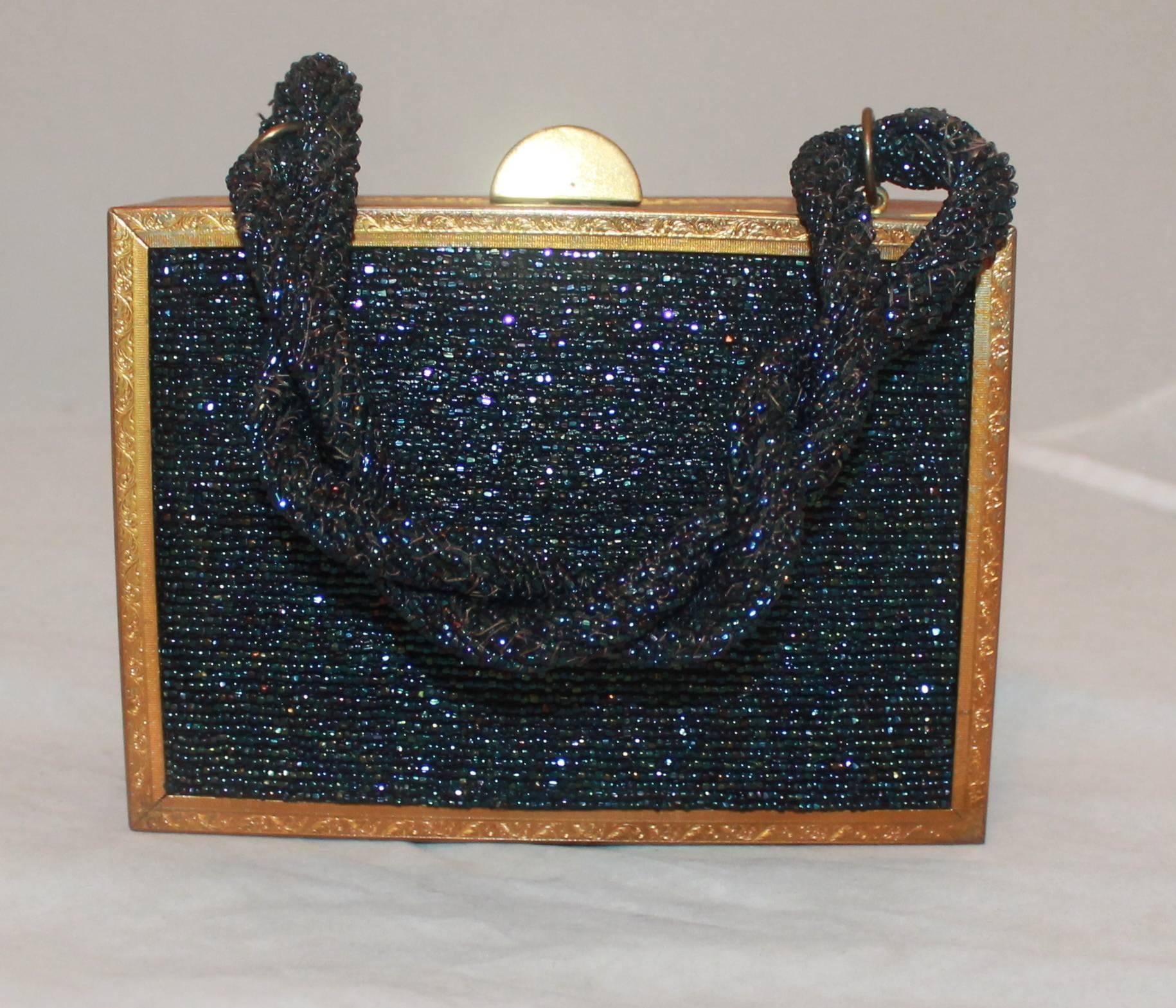 Evans Navy & Gold Vintage Beaded & Metal Rectangular Handbag - Circa 1950's.  This handbag is in good vintage condition, through age it became slightly unaligned.  It features a goldtone metal frame and lovely navy multi beading.  Also, the handle