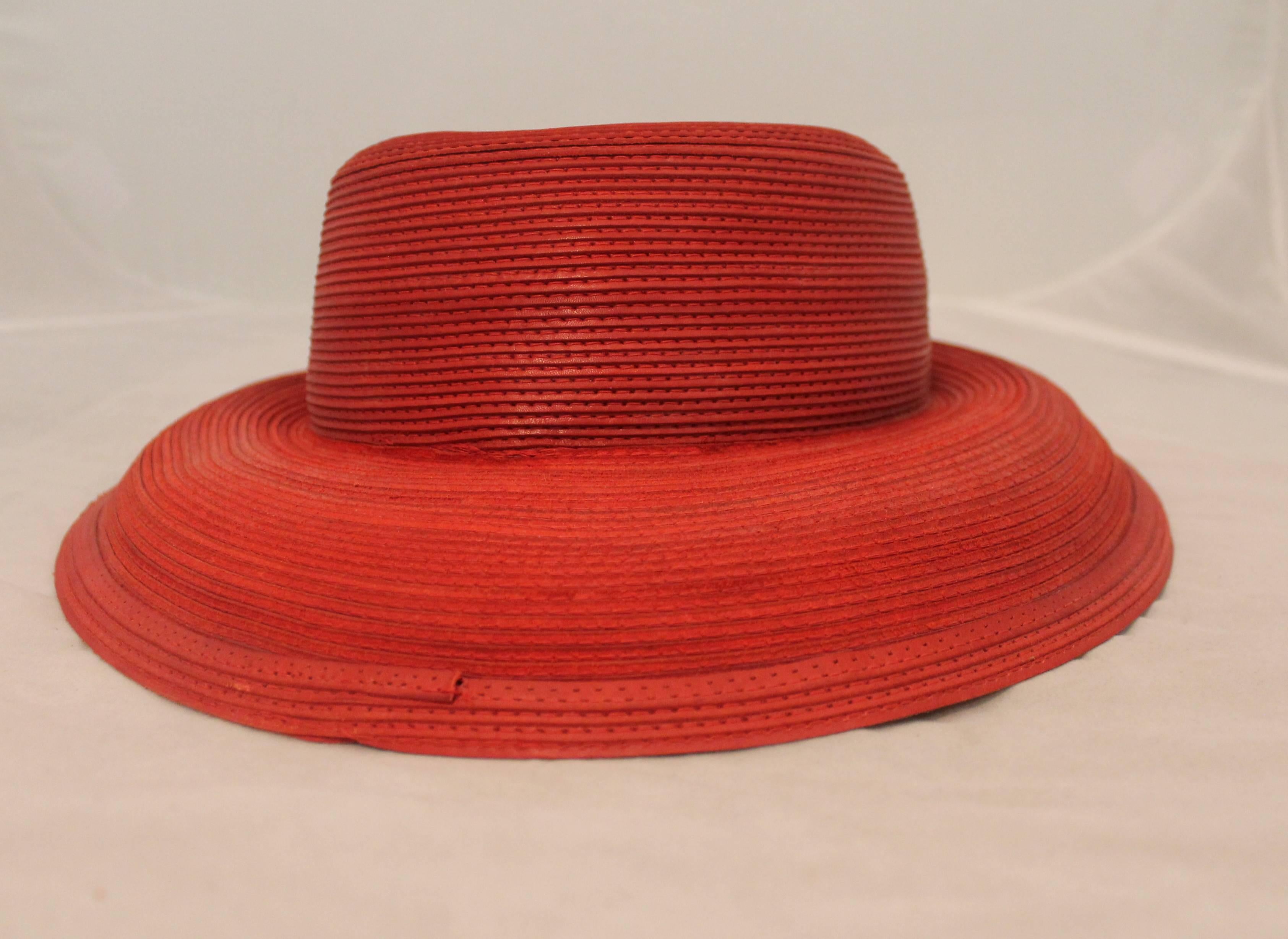 Patricia Underwood Vintage Red Leather Hat - circa 1990's. This hat is in excellent condition and has a pleated look all over. The brim of the hat can be flipped up or down for two different looks. 

Circumference: 21.5