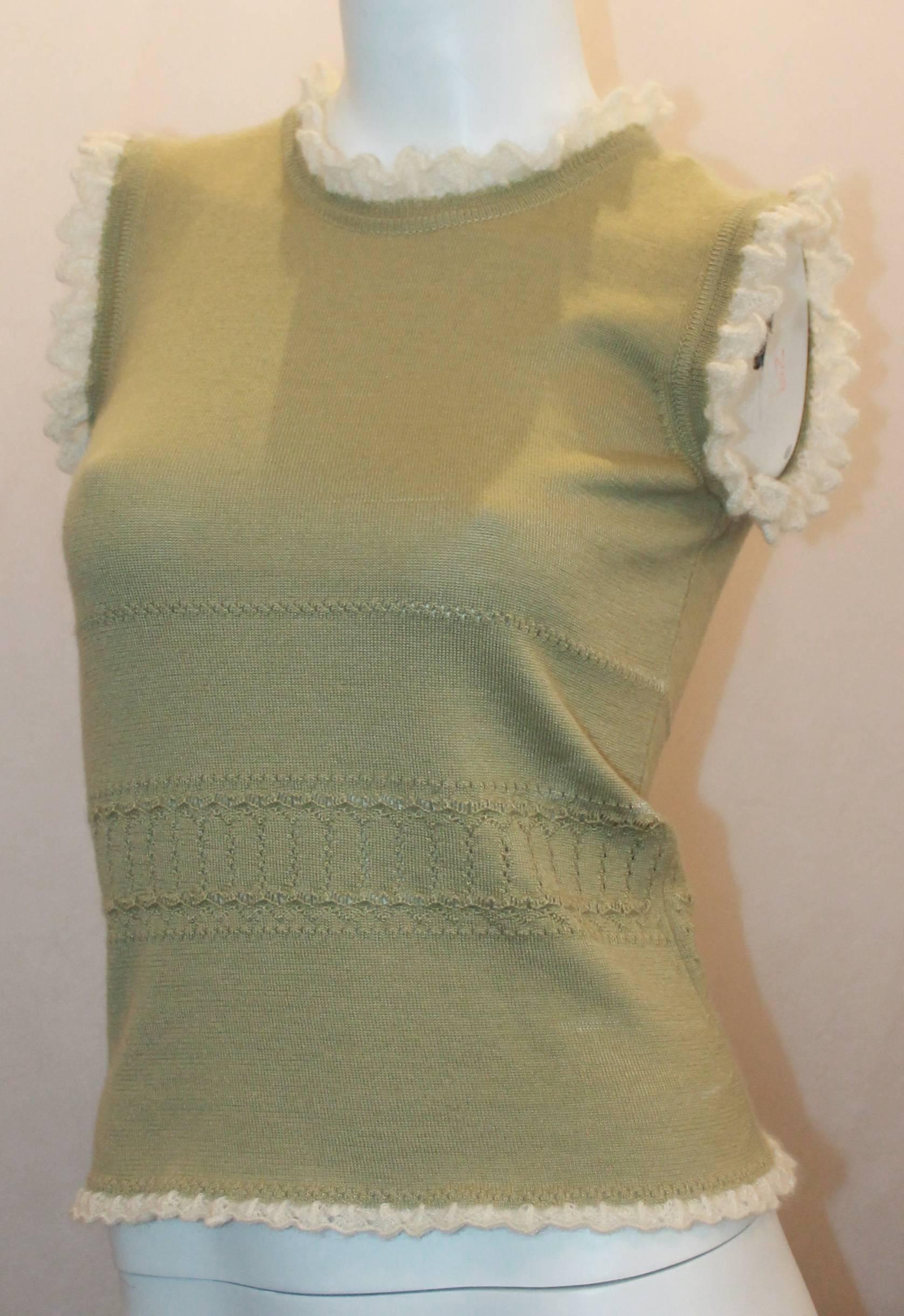 Oscar de la Renta Pastel Green Cashmere Sleeveless Top w/ Knit Ruffle Trim - S.  This lovely top is in excellent condition.  It features a lovely pastel green cashmere material, a feminine knit ruffle trim, a single pearl button on the back, and a