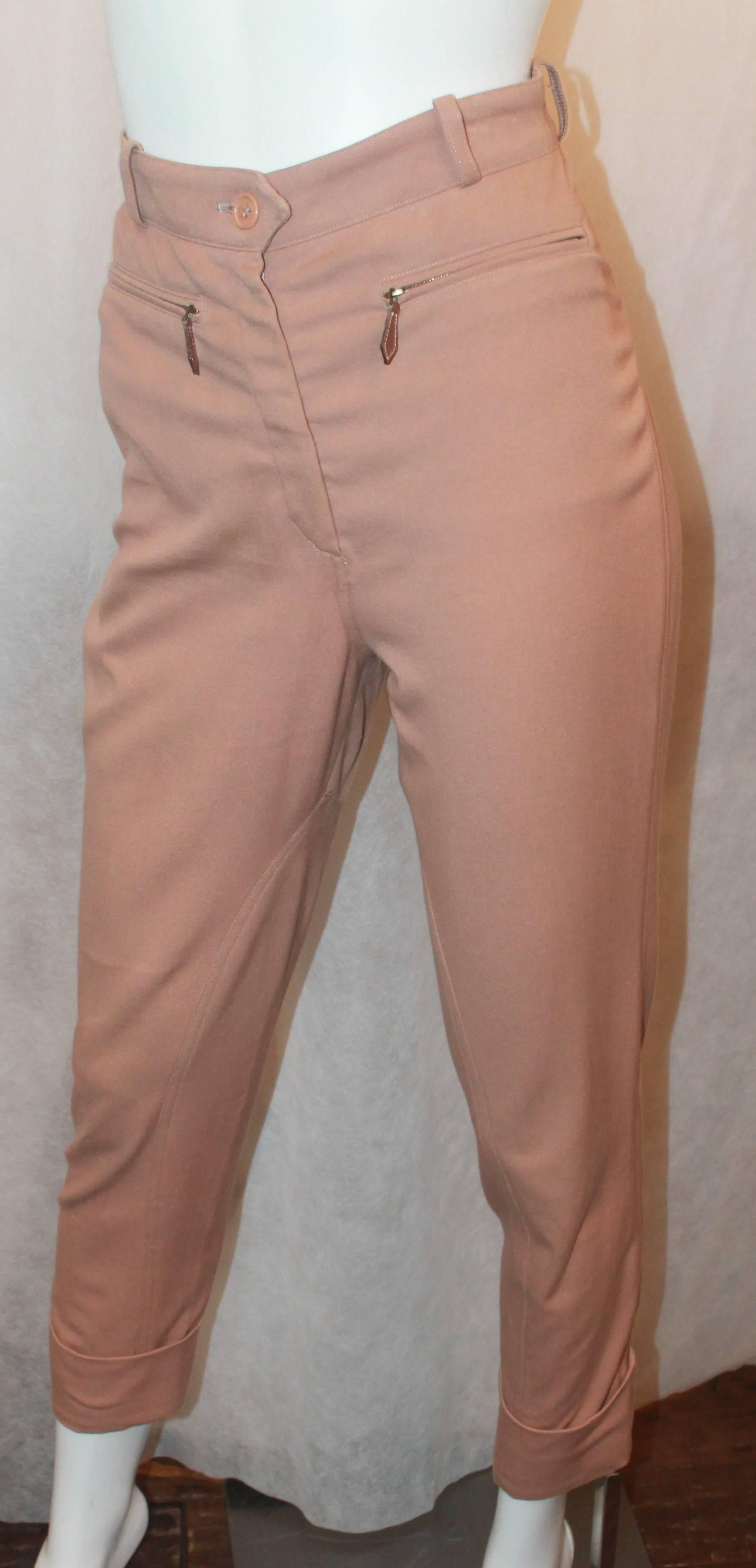 Hermes Vintage Mauve Riding Pants with Leather Detail - 36 - 1990's. These pants are in good vintage condition with wear consistent with its age. They have a cuffed bottom and leather zips. There are 2 front pockets and they are high waisted pants.