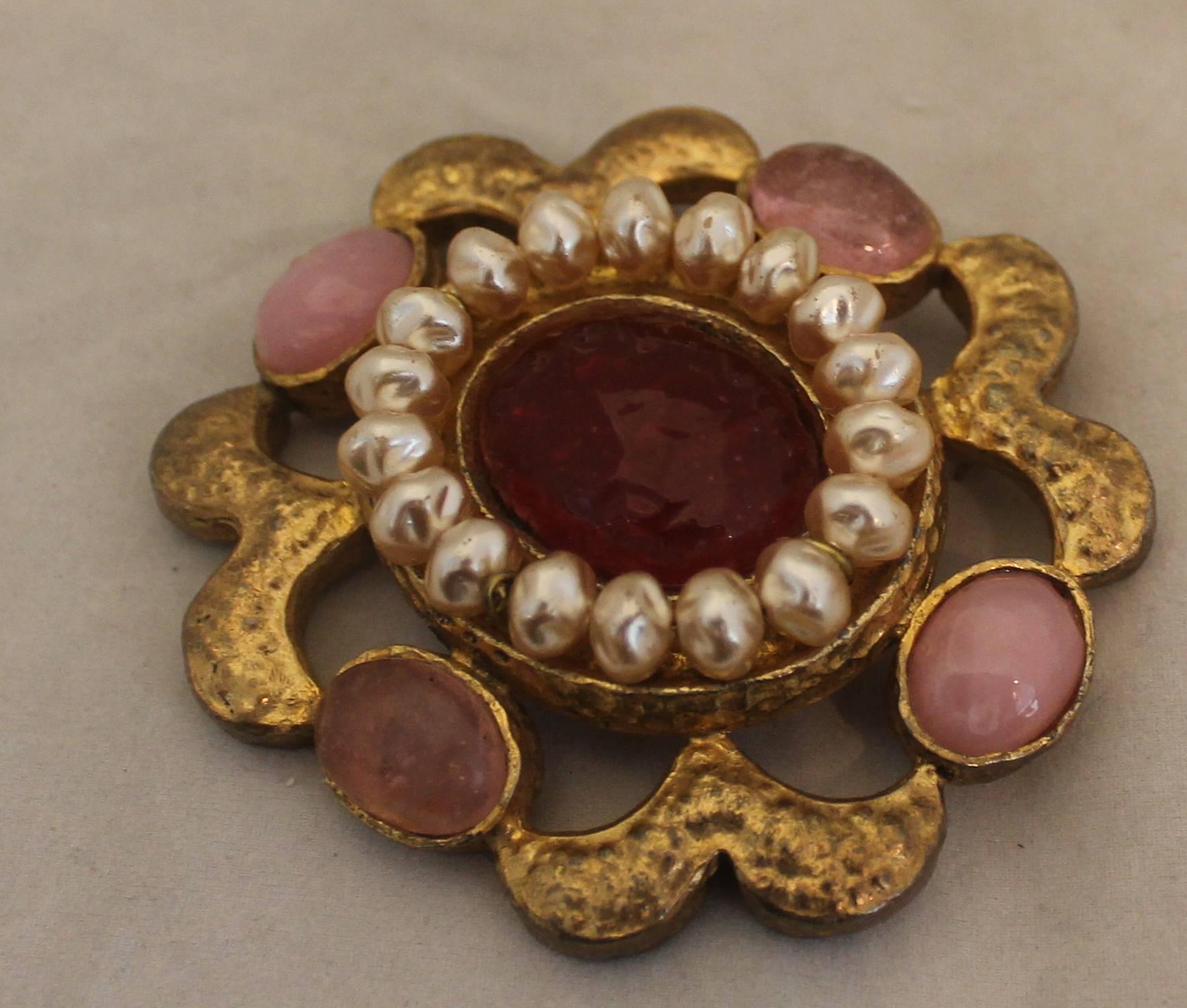 Chanel Vintage Gold Brooch & Pendant with Pink Gripoix & Pearl - circa 94P. This brooch is in excellent vintage condition and has an ornate look. The gripoix stones are a lighter and darker pink and the goldtone material is hammered. The pearl trim