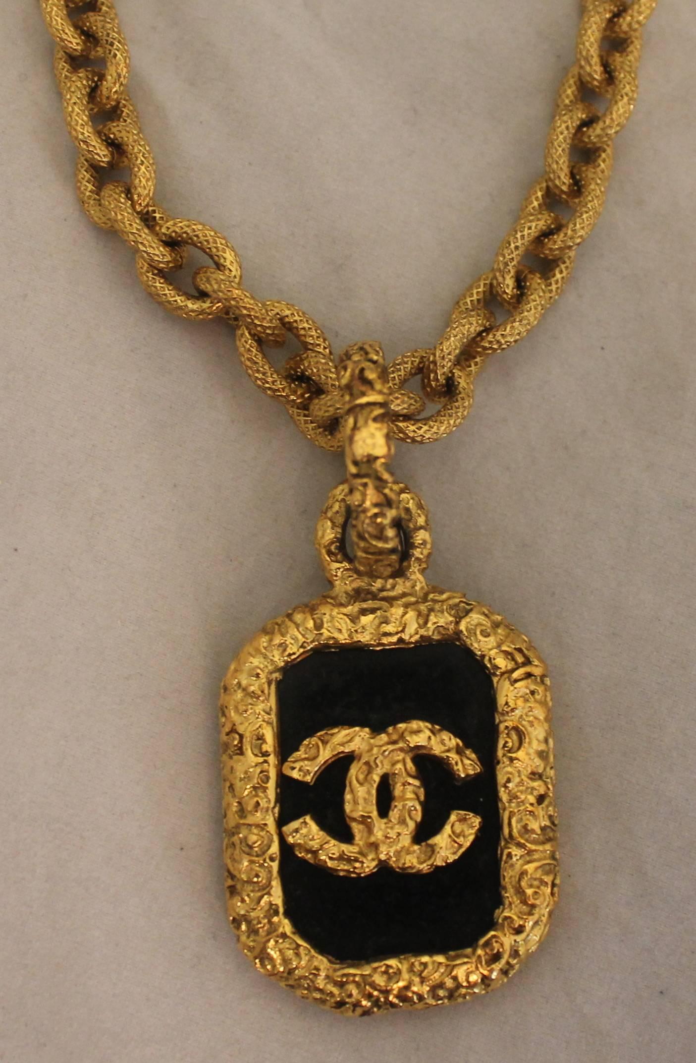 Chanel Goldtone Byzantine Link Necklace with Black Glass Pendant  - Circa 96. This vintage piece is in excellent condition and has an amazing look. The link has a different texture than the pendant giving it a Baroque-Byzantine look that is classic