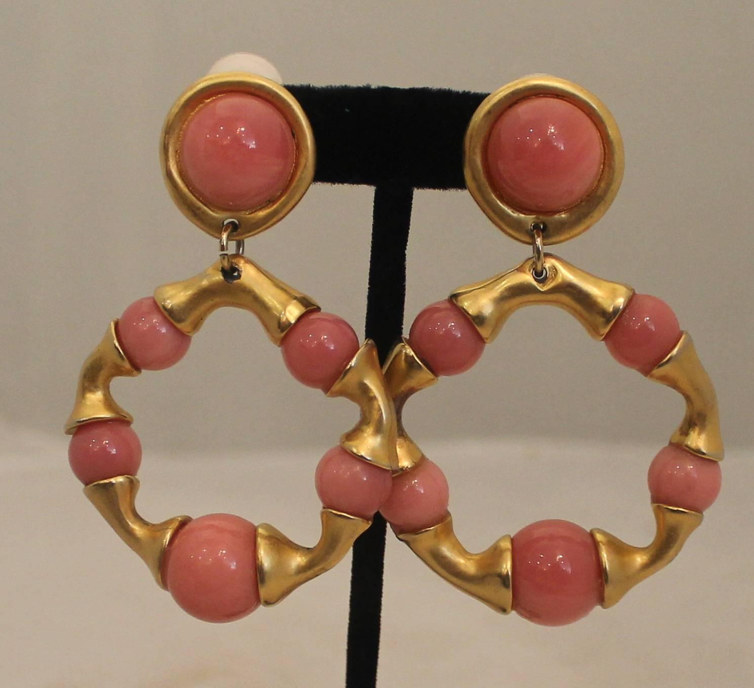 Chanel Goldtone & Pink Gripoix Hoop Clip-On Earrings - Circa 1993.  These lovely Chanel earrings are in very good vintage condition with only minor discolorations consistent with their age.  These feminine earrings feature a lovely goldtone metal, a