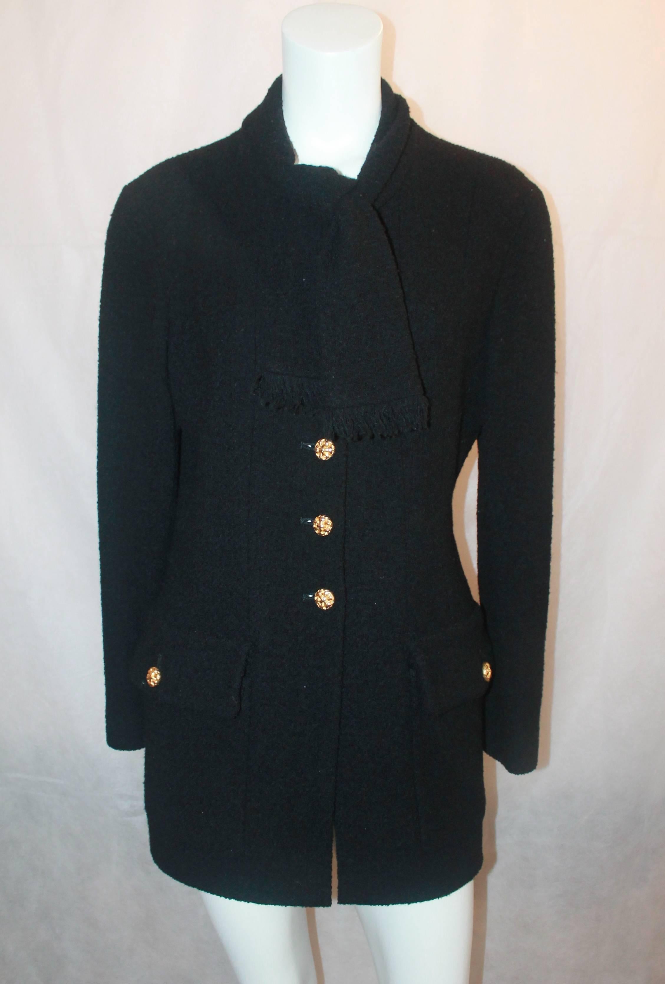 Chanel Vintage Black Wool Long Jacket with Neck Tie - 40 - circa 1980's. This jacket is in excellent condition and is a classic, staple Chanel piece. This lovely jacket features an attached neck tie, 2 front pockets, goldtone woven-like buttons, and