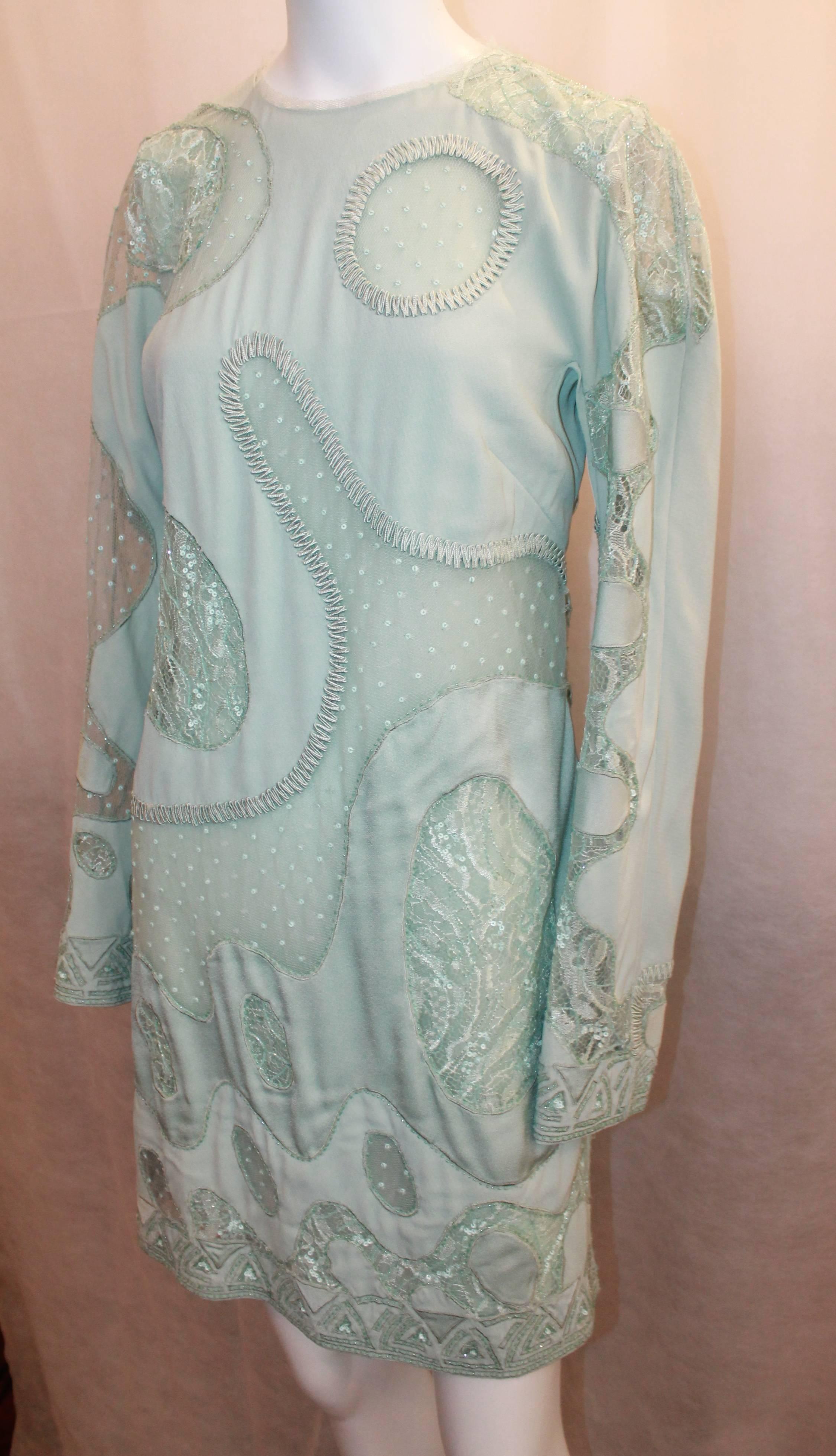 Emilio Pucci Aqua Silk Chiffon Long Sleeve Dress with Sheer Cutouts - 10. This dress is in very good condition with some pulling throughout, consistent with such a fragile piece. The sheer fabrics are lace and point d'esprit with sequins and