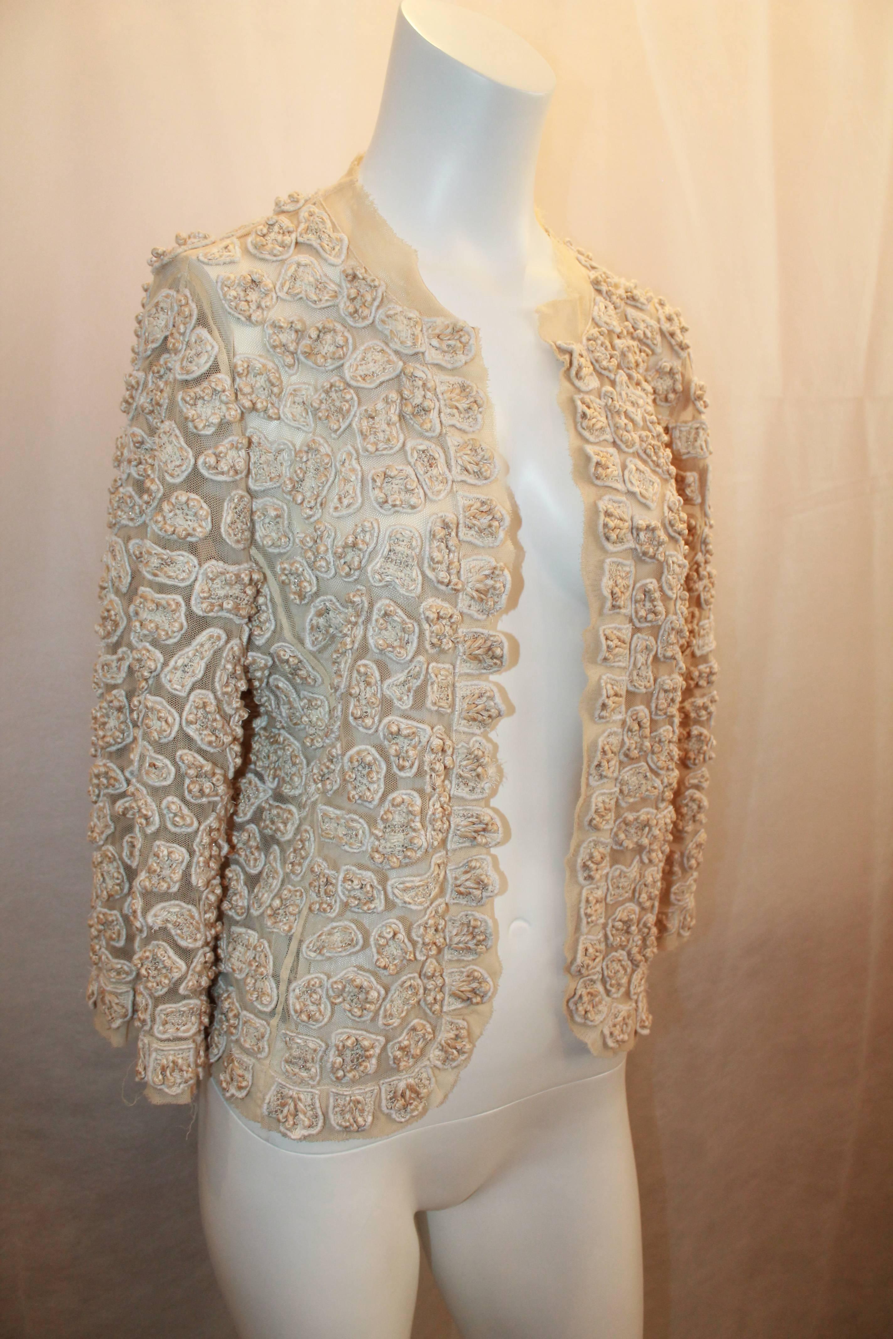 Oscar de la Renta Ivory Cotton Blend Heavily Embroidered Soutache Lace Jacket - Size 6 from the 2007 Resort Collection.   This gorgeous jacket is in excellent condition with only minor threads beginning to come loose on the mesh.  It features a mesh