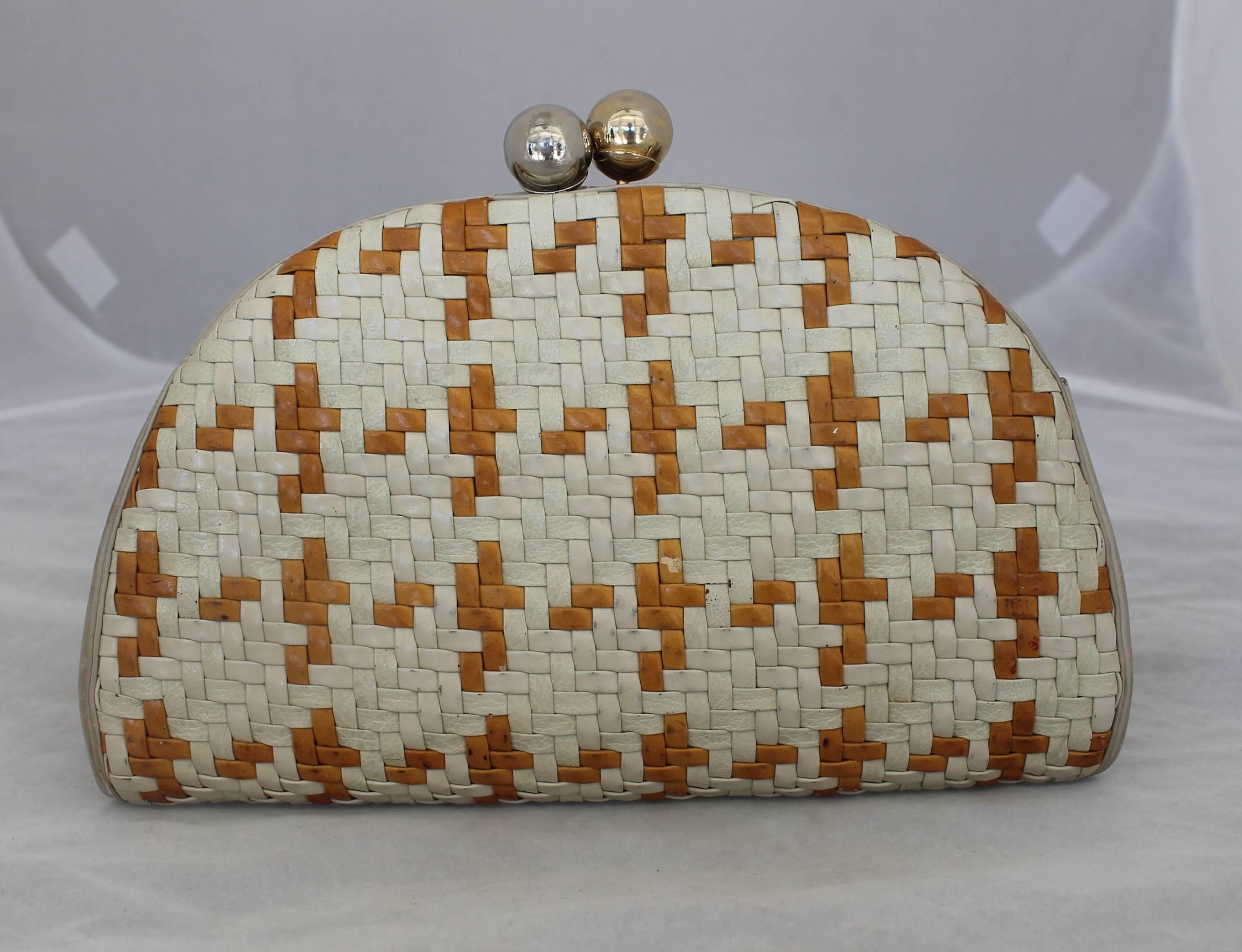 Judith Leiber Ivory & Mustard Woven Bag with Mixed Hardware - circa 1990's. This bag is in fair vintage condition with visible wear. The woven areas have scuffs along both sides and there is also discoloration on the inside lining. However, this is