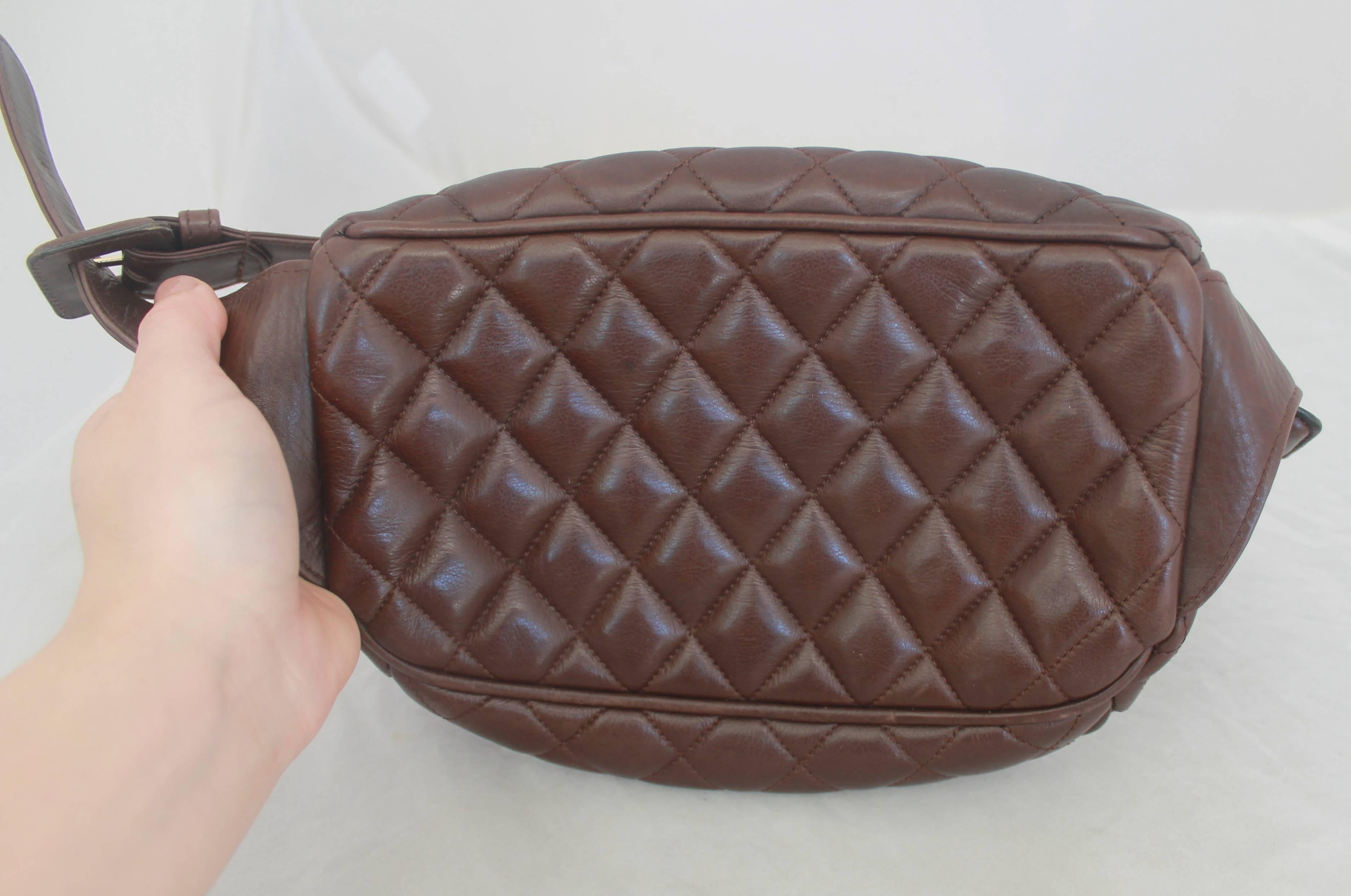 Chanel Vintage Brown Quilted Lambskin Fanny Pack - GHW - Early 1980's. This vintage fanny pack has a belt buckle adjustment on both sides, gold hardware, a hanging 