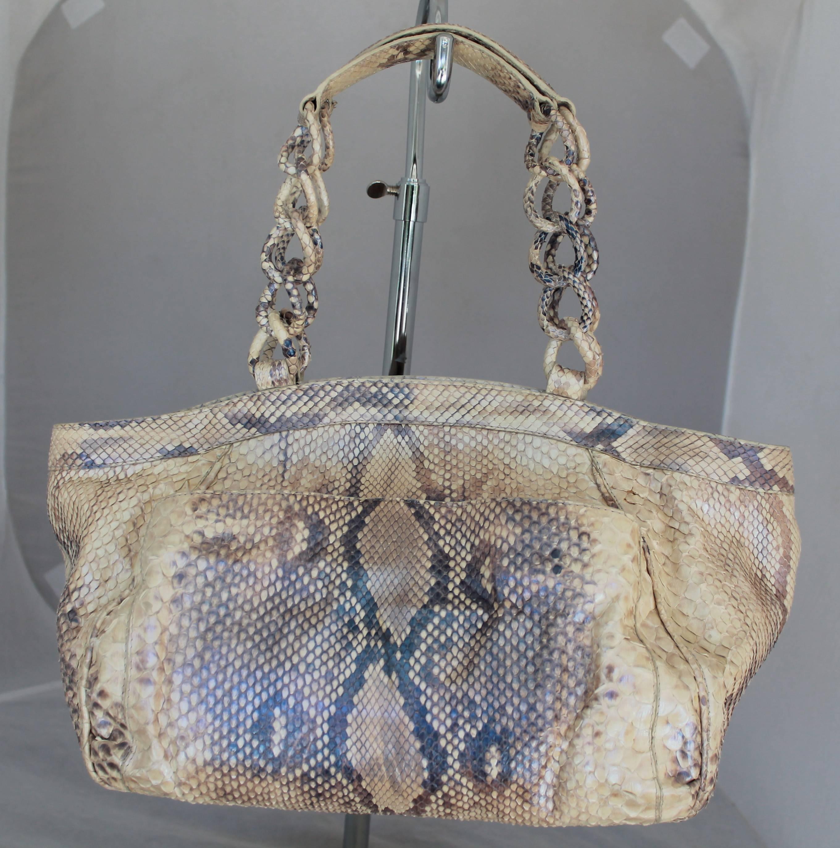 Nancy Gonzalez Earthtone Metallic Python Shoulder Bag. This bag is a combination of beige and brown metallic python, the strap has python covered links on each side. The top of the bag has a magnetic closure, and the inside of the bag has a large