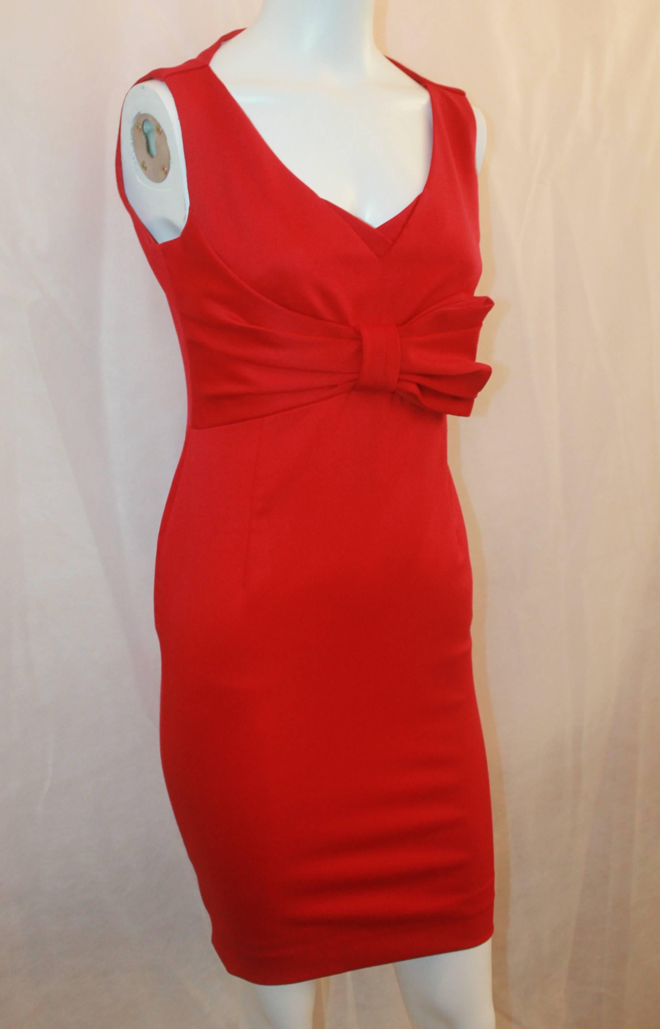 Valentino Techno Couture Red Sleeveless Dress with Bow - 4. This beautiful dress is in excellent condition and is a perfect sexy and elegant piece. It features a v-neck, bow design in the front, and a fitted bodice. The dress is a wool-jersey heavy