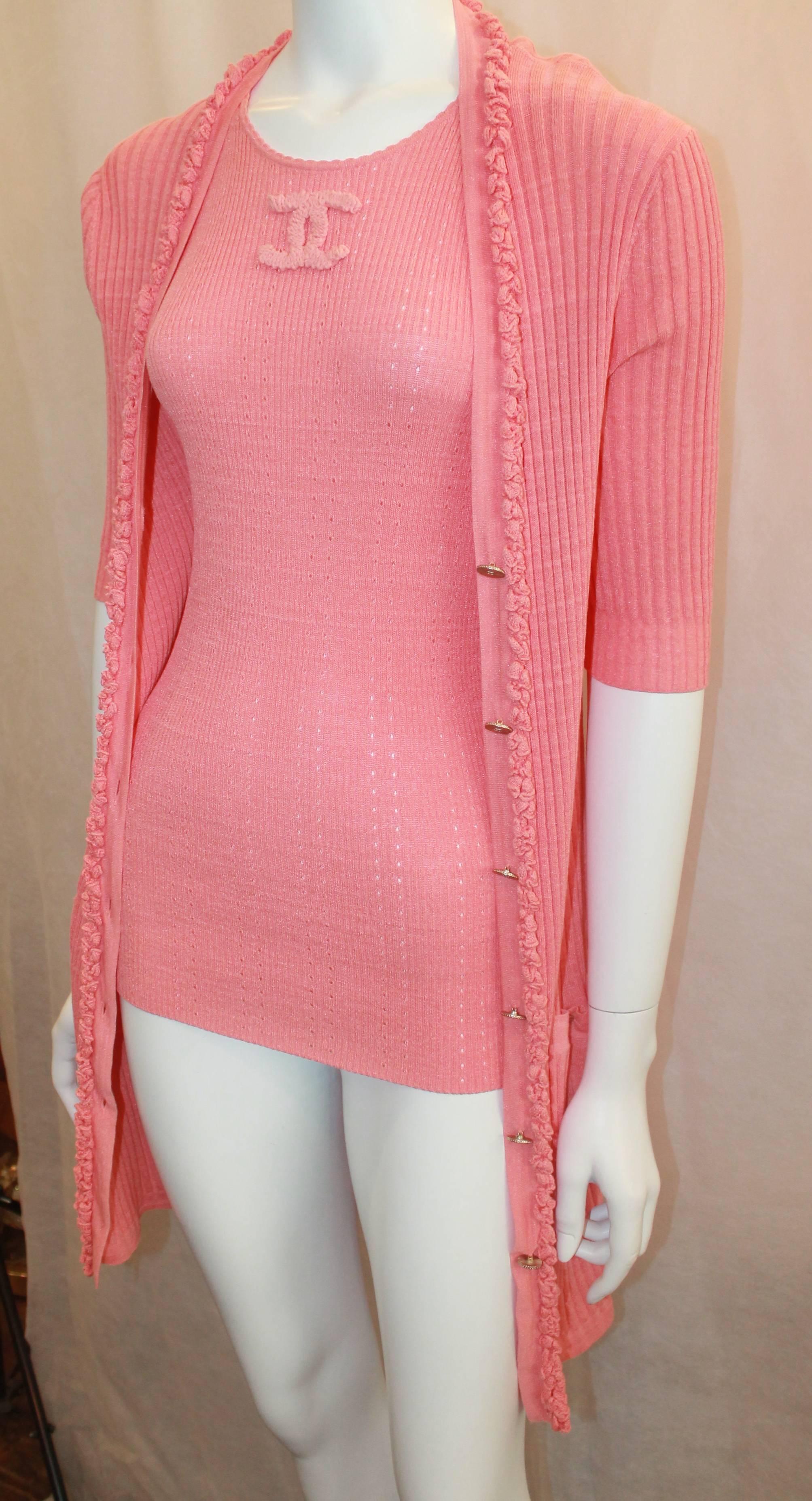 Chanel Coral Cotton Blend Knitted Sweater Set - 42 - 09P. This Chanel, knitted, cotton-nylon blend, sweater set is great for the summer. The sweater set is composed of a sleeveless knitted tank with a ruffled 