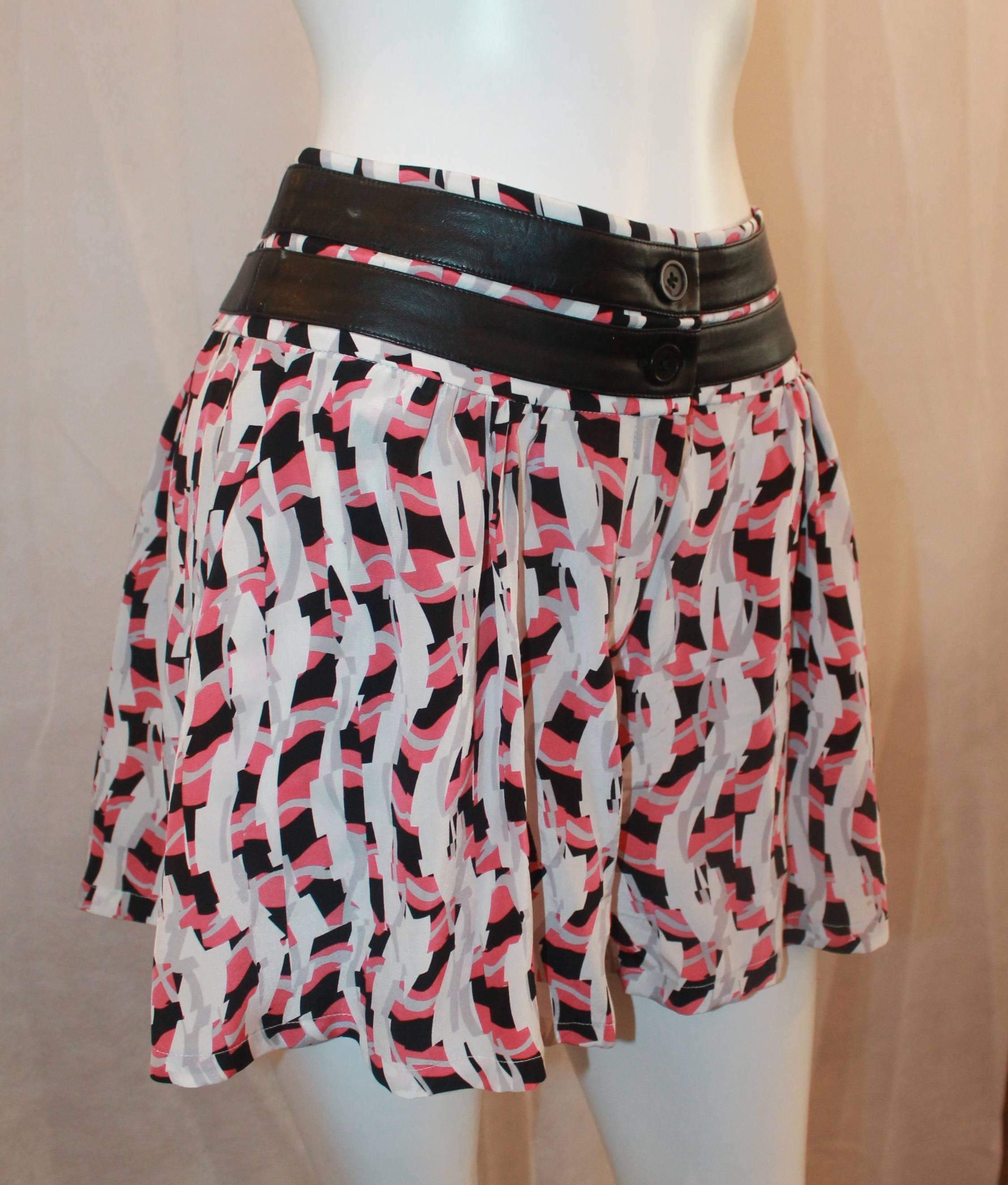 Karl Lagerfeld Pink, White & Black Silk Geometric Printed Shorts - 6. These shorts are cute and in excellent condition. They feature 2 pockets, pleating in the front, and faux leather strips along the waist.

Measurements:
Waist- 30.5