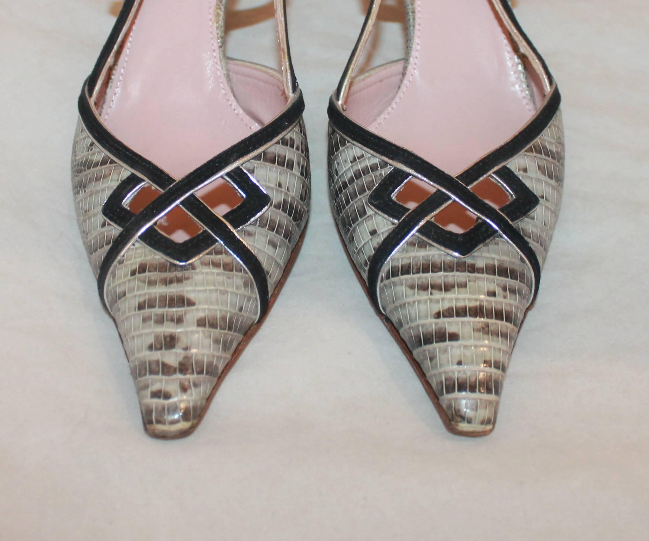 Prada Silver and Black Lizards and Suede Strappy Slingbacks - 35.5. These slingbacks are beige lizard skin with black and silver suede trim and cutouts on the top. They are in excellent condition with minor wear on the bottom.

Measurement
Heel: