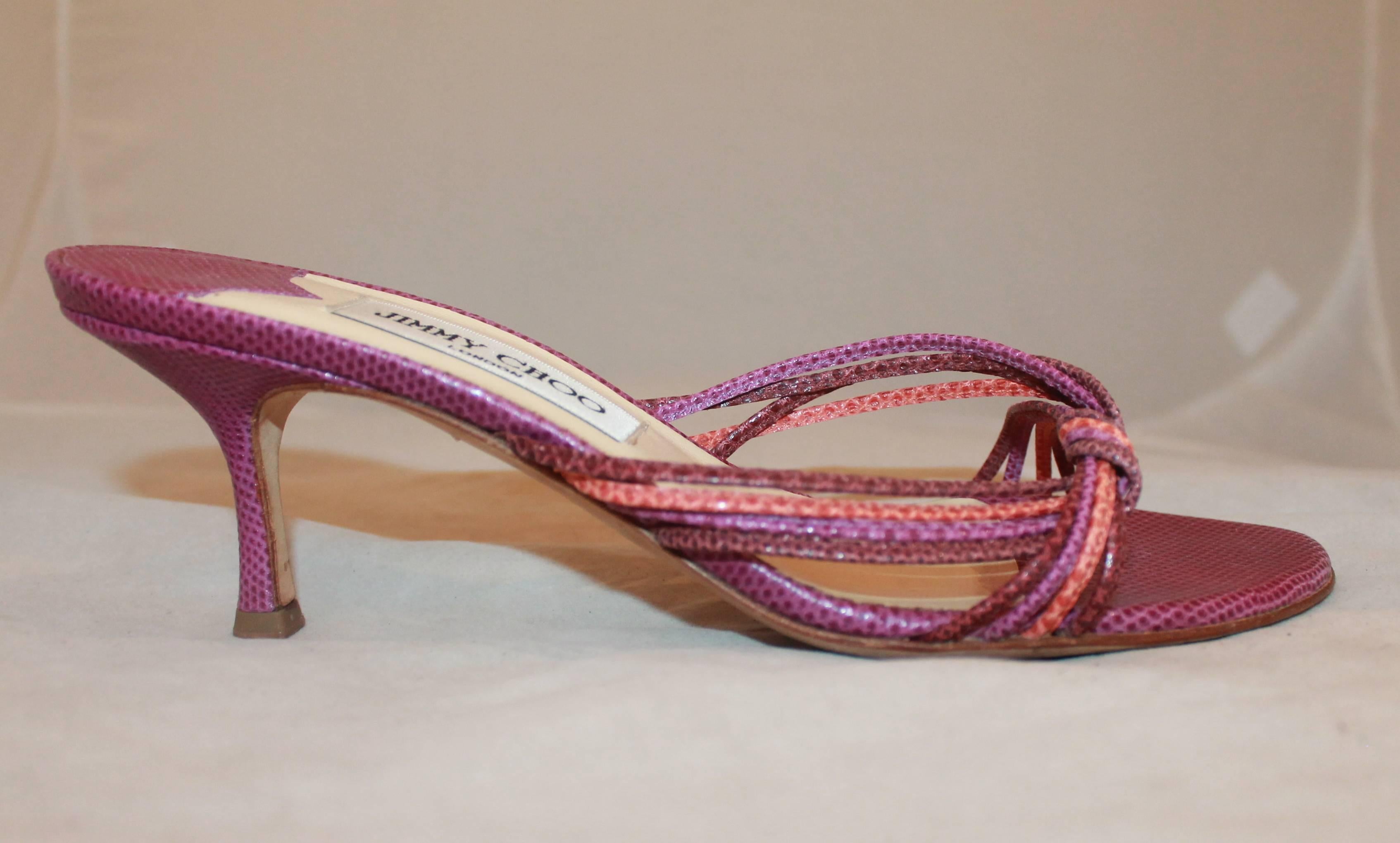 Jimmy Choo Purple and Coral Lizard Woven Slides with Heels - 39. These slides are purple lizard-skin with single-woven strips. They are in excellent condition and show only minor wear on the bottom.

Measurements:
Heel: 2.5