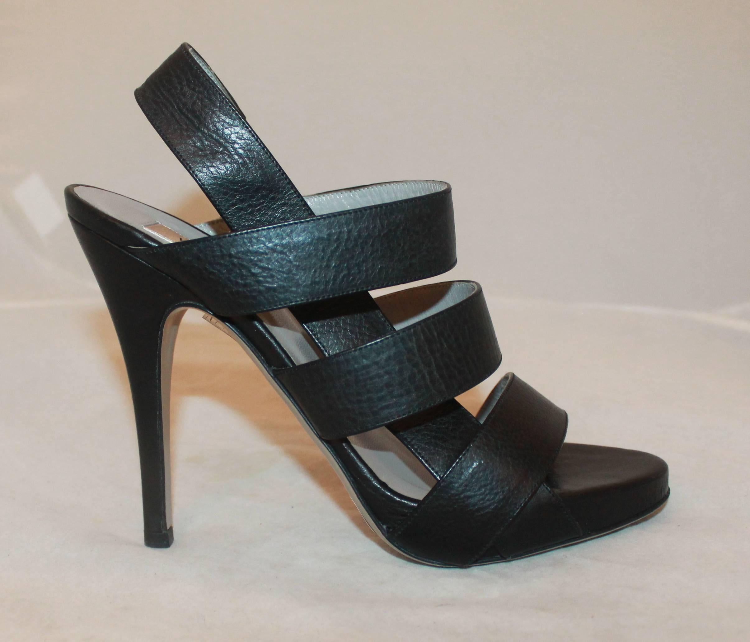 Valentino Black Leather Strappy Platform Heels - 37. These heels are in excellent condition with very minor wear on the bottom. 

Measurements:
Platform: 0.5