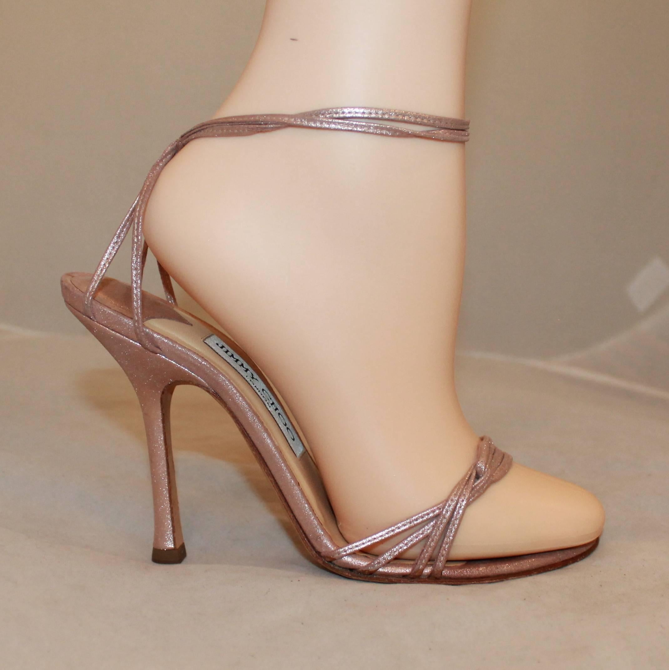 Jimmy Choo Rose Gold Woven Thin Strap Sandals with Ankle Strap - 37. These elegant heels have an ankle strap and have multiple thin, woven straps on the top. They are in good condition are show general wear along with minor bottom wear.