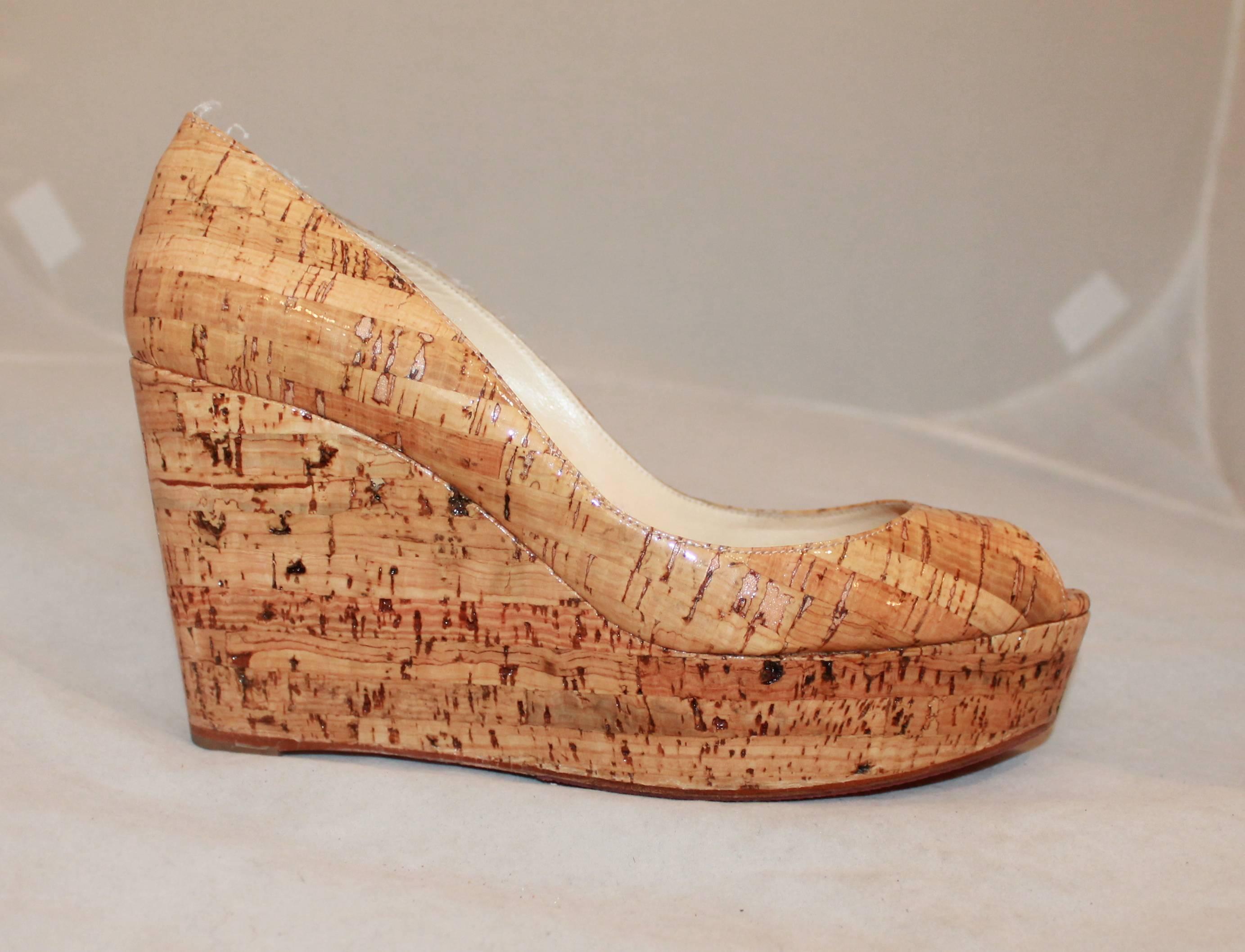 Louboutin Glossy Cork Peep-toe Wedges-38. These wedges are very nice for the summertime and are in excellent condition with a re-done bottom.

Measurements:
Platform- 1.25